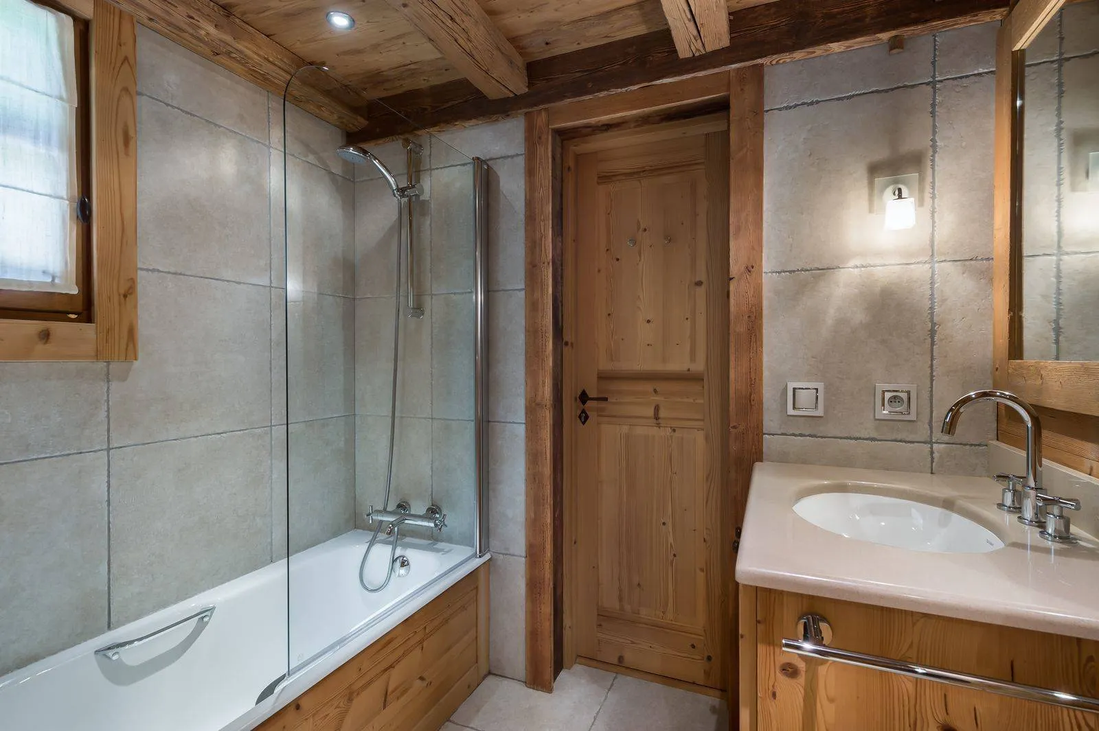 Bathroom with a bath and shower