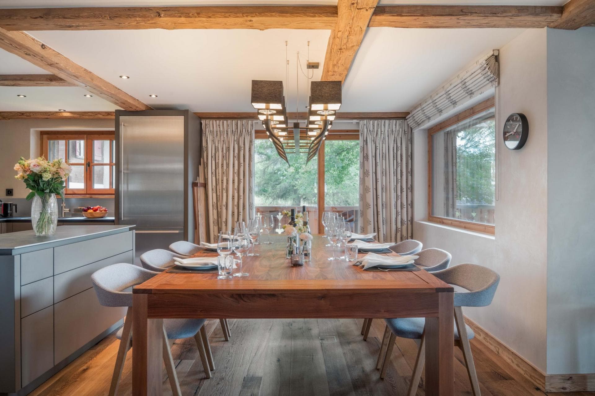 Dining area with seating for 10 adjacent to open-plan kitchen