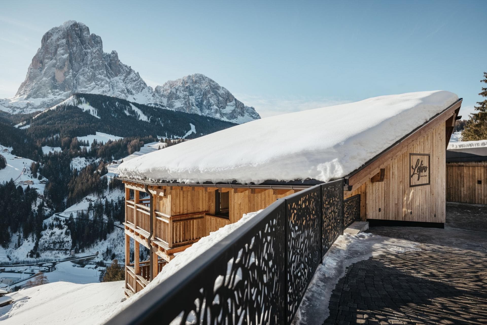 Chalet entrance and balcony with panoramic Dolomite mountain views