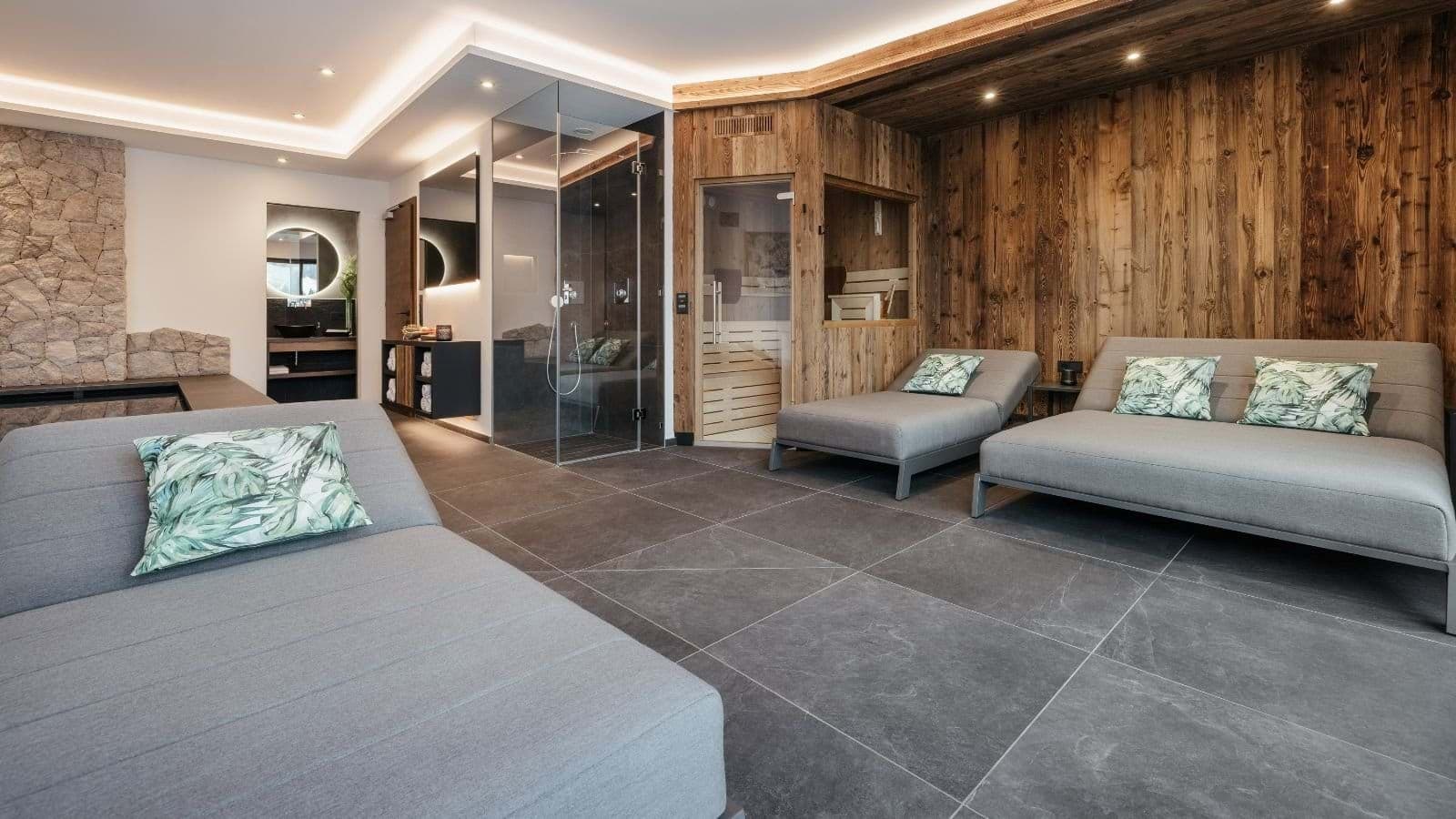 Spa area with private wooden sauna and glass-enclosed shower