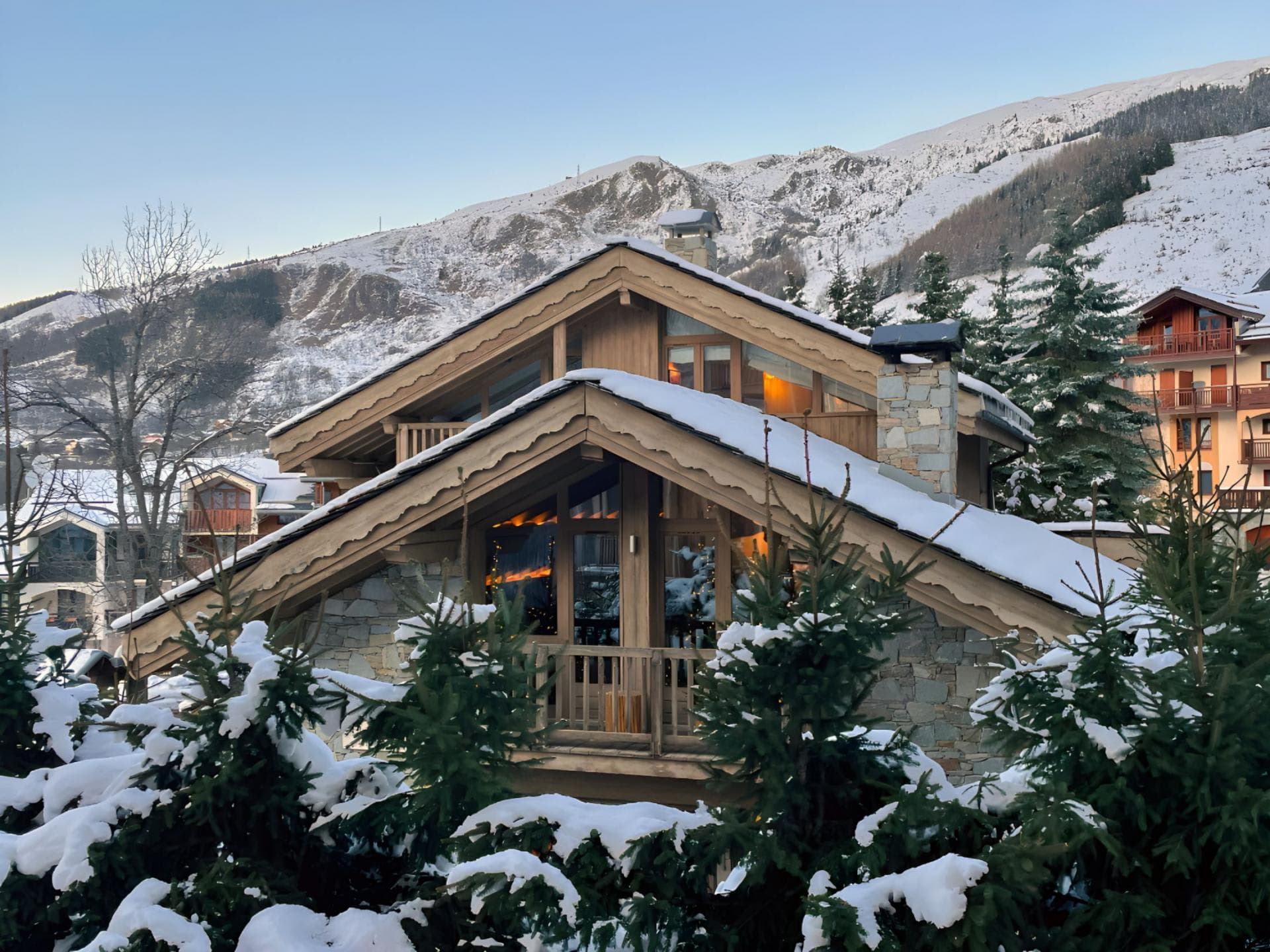 Alpine chalet with stone masonry and private balcony overlooking mountains