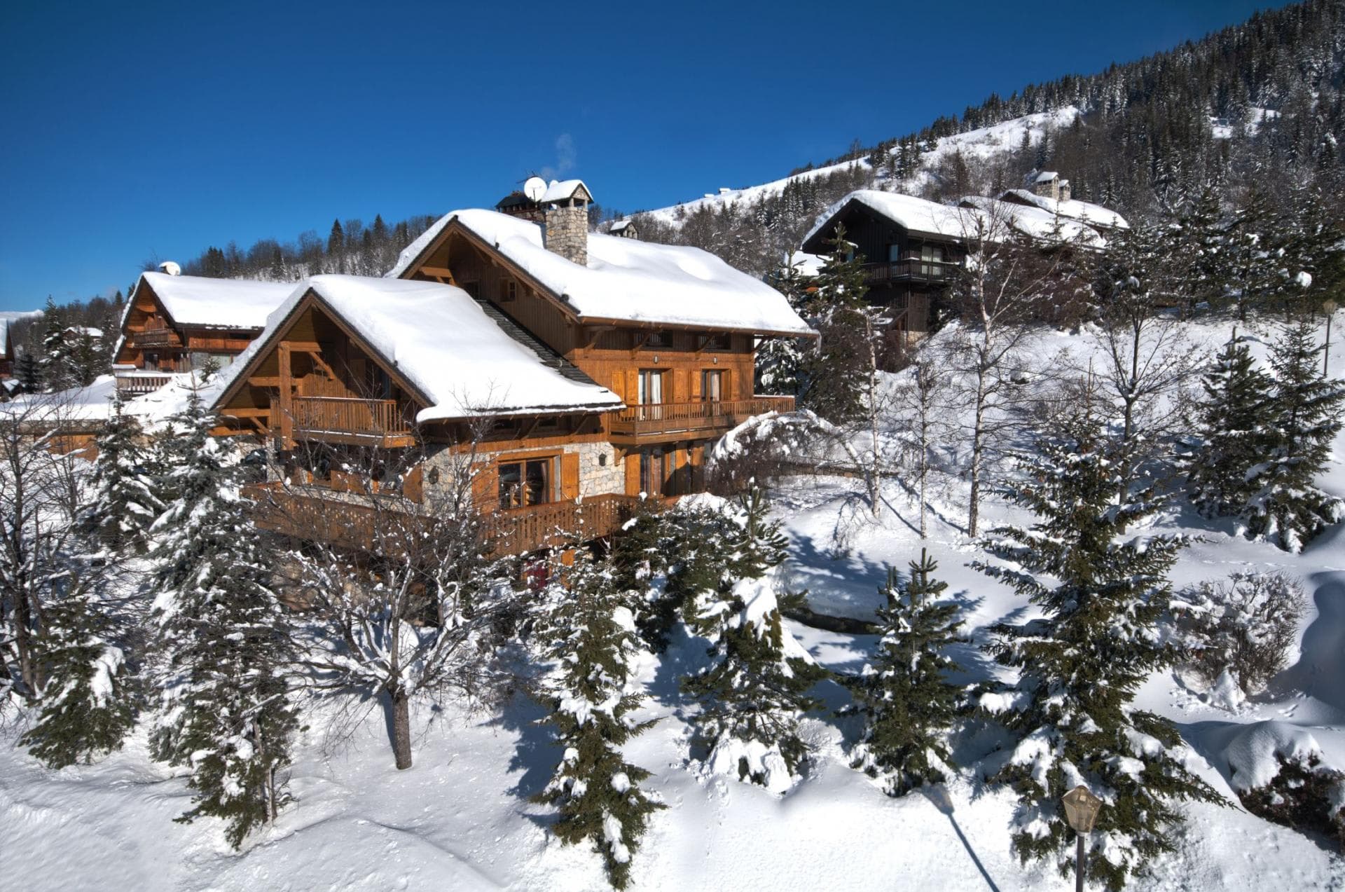 Ski-in, ski-out timber chalet with wrap-around balconies