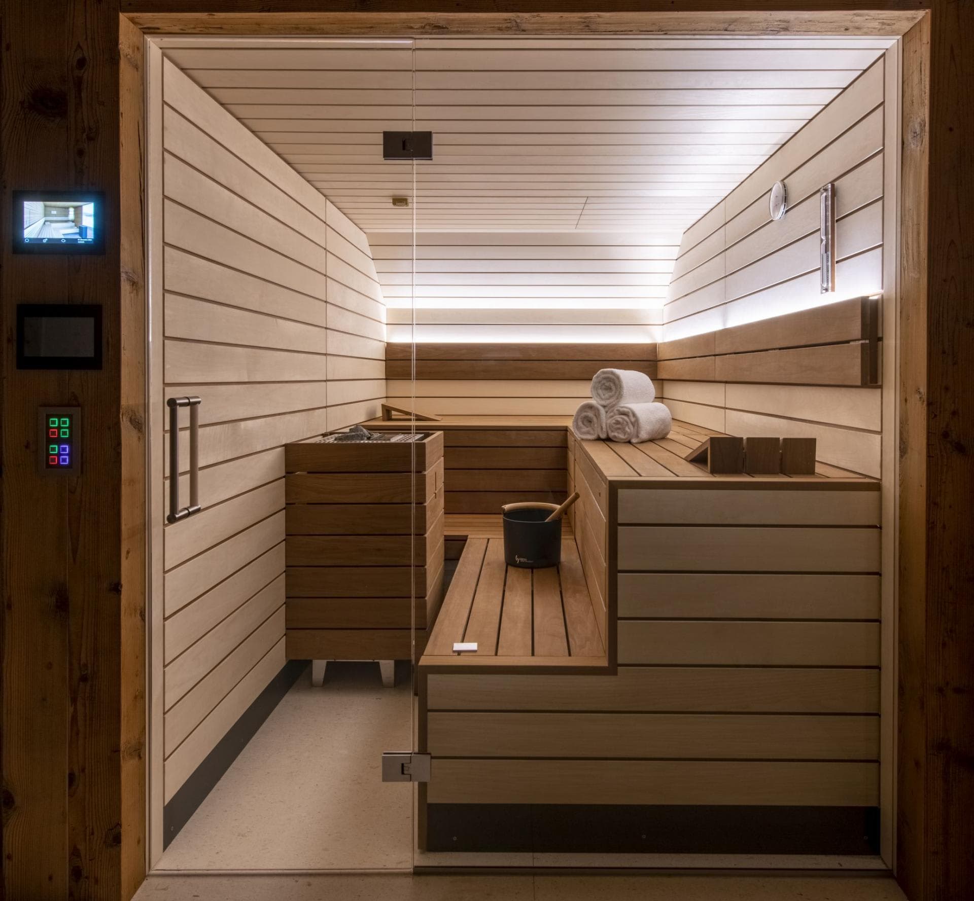 Private cedar sauna with tiered seating and digital temperature controls