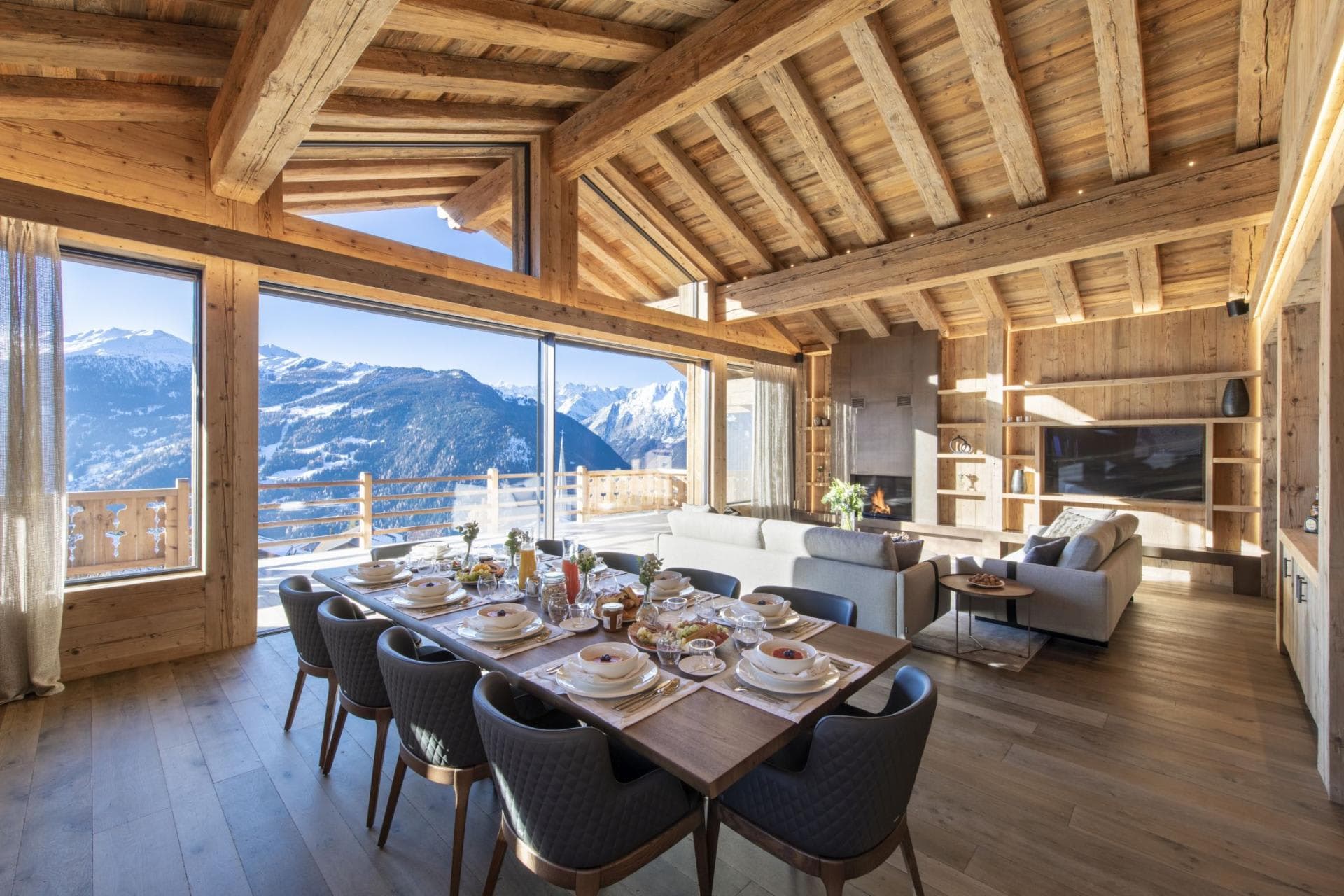 Open-plan dining and living area; table seats 10 with mountain views