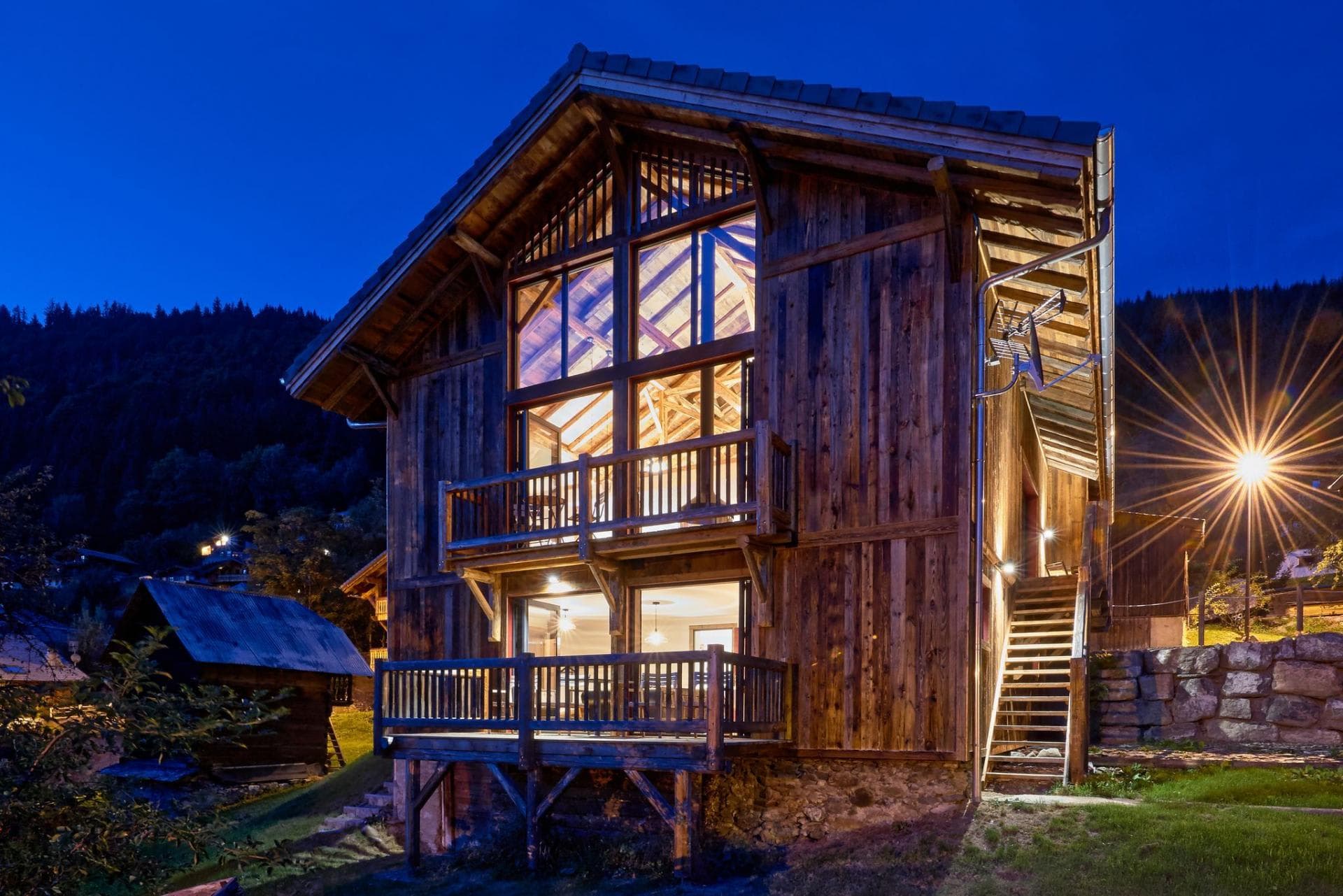 Chalet exterior with two levels of private decks and floor-to-ceiling windows