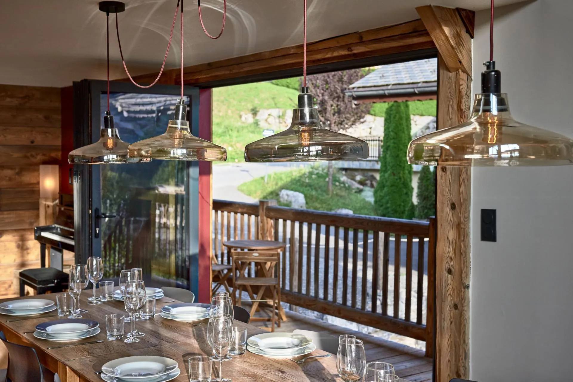 Dining area with glazed doors opening to a private balcony