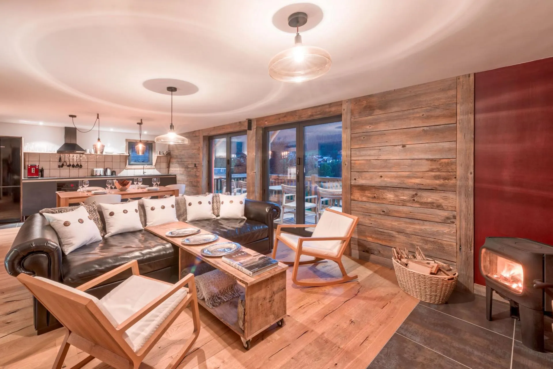 Second living room with a wood-burning stove and terrace access
