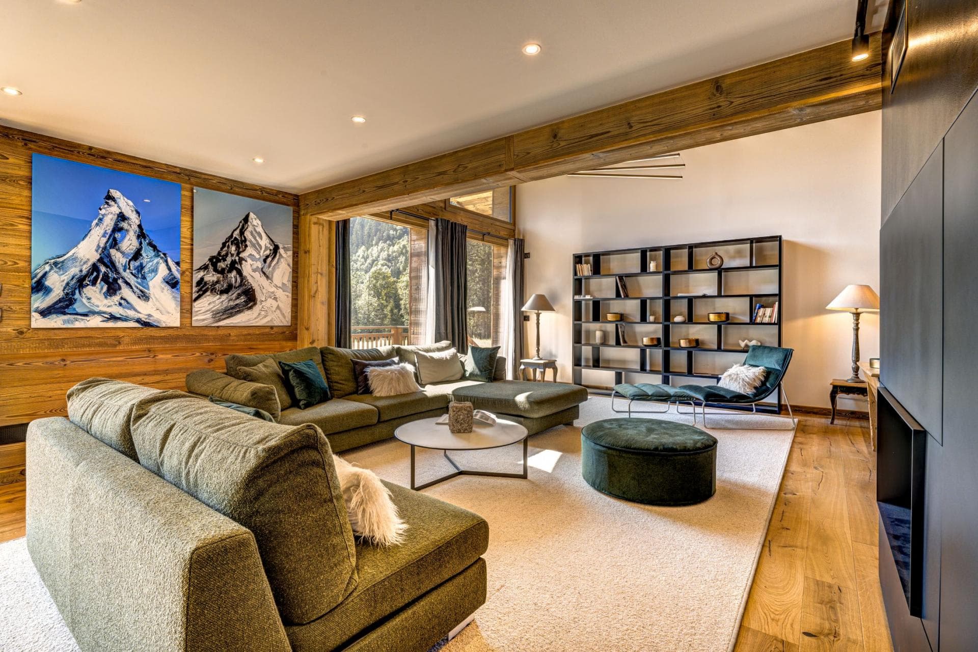 Living area with sectional seating for 8 and floor-to-ceiling windows