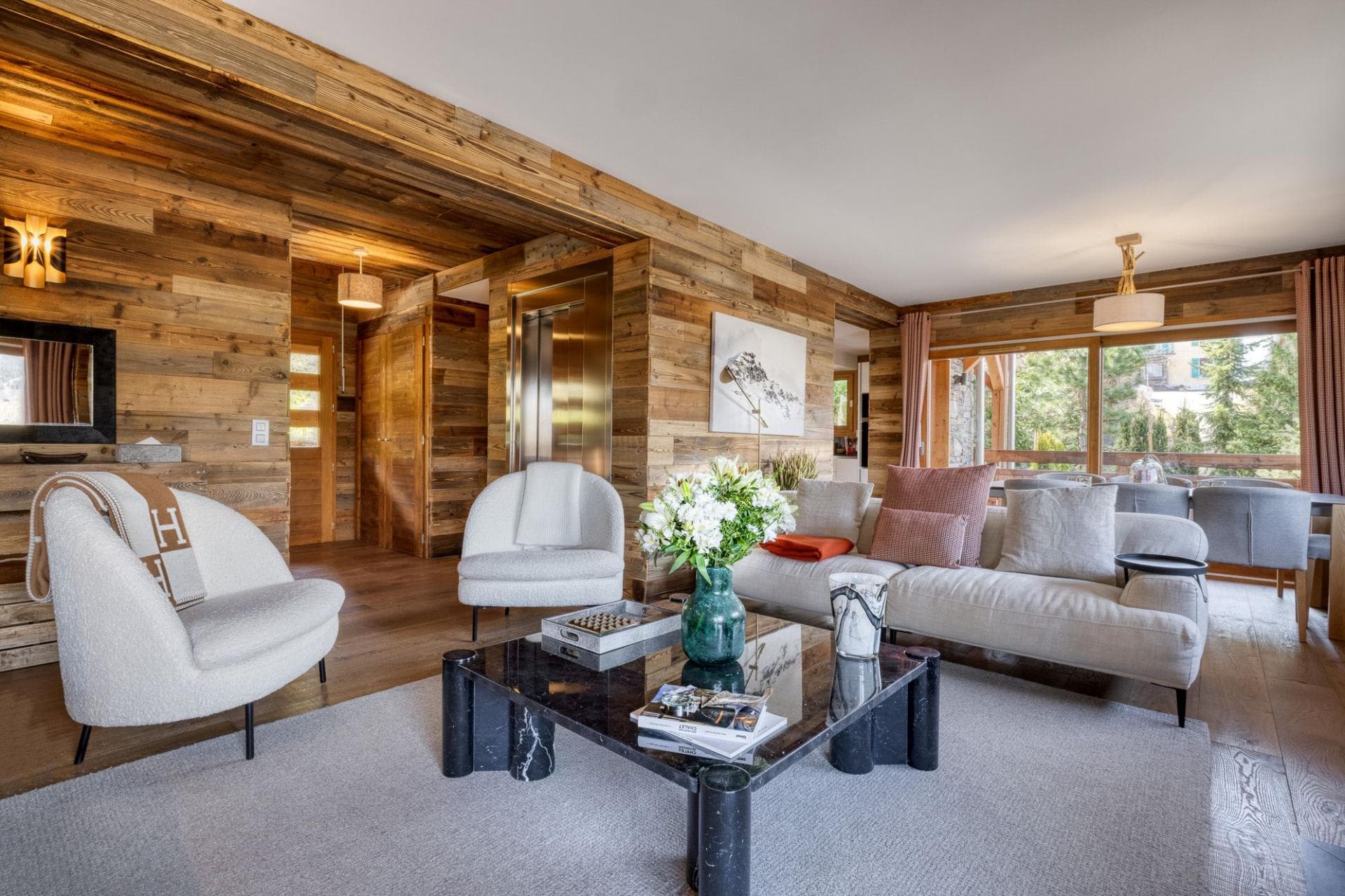 Living area with reclaimed wood walls and internal elevator access