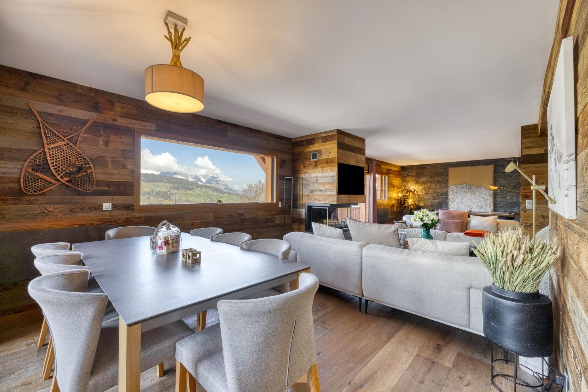 Open-plan living area; dining table seats 8 with mountain views