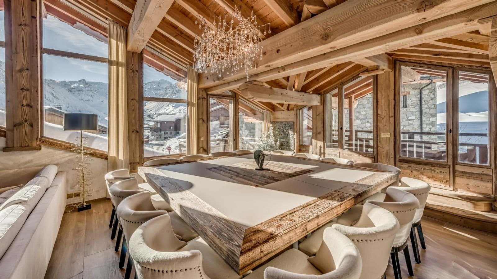Dining room seats 12; floor-to-ceiling windows with alpine valley views