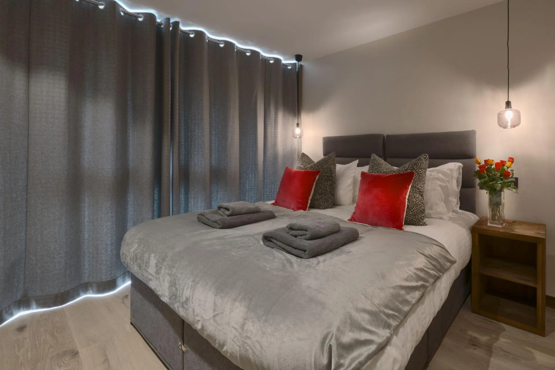 Double bedroom with floor-to-ceiling curtains