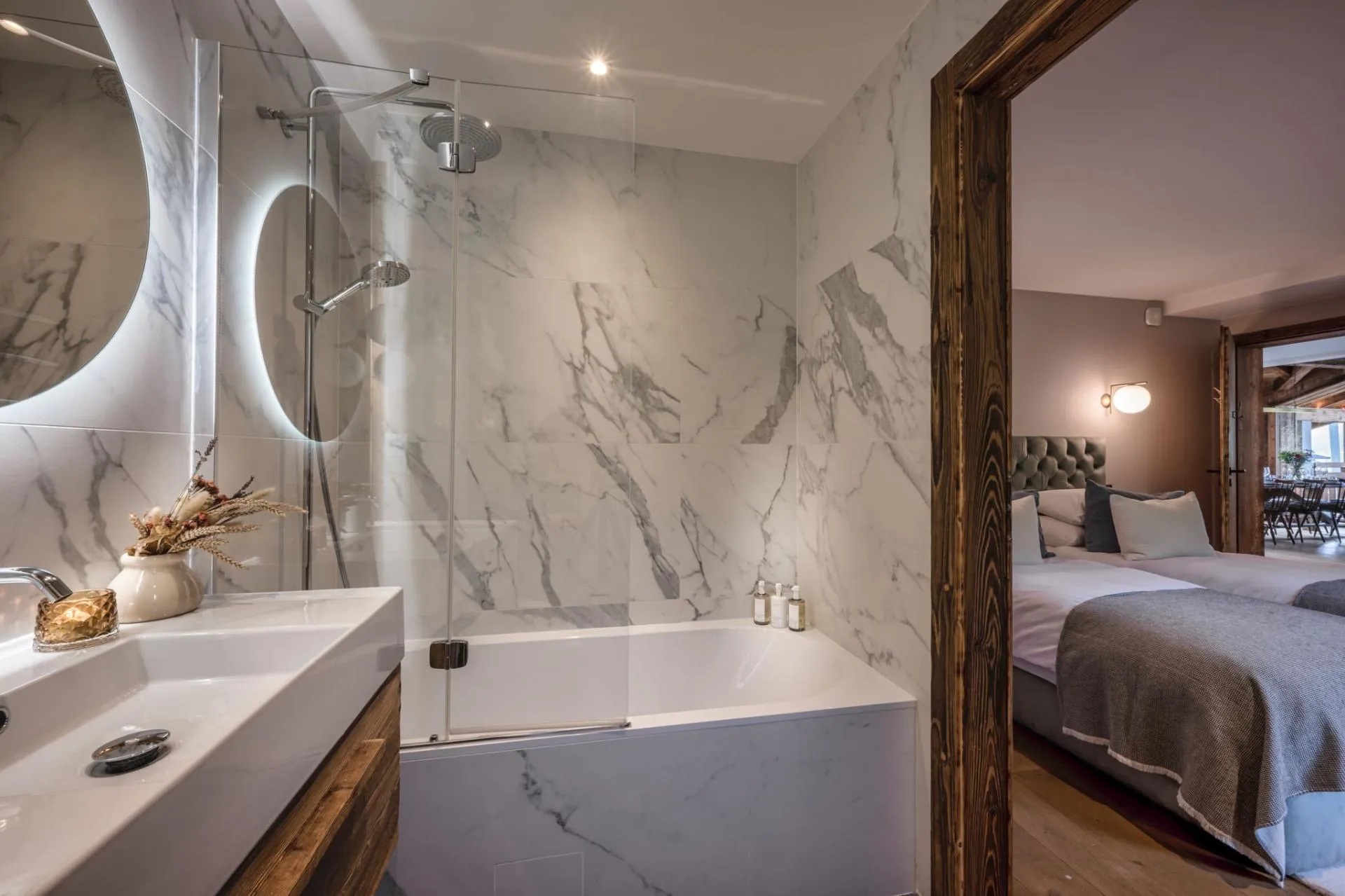 En-suite bathroom with a bath, shower and twin basins