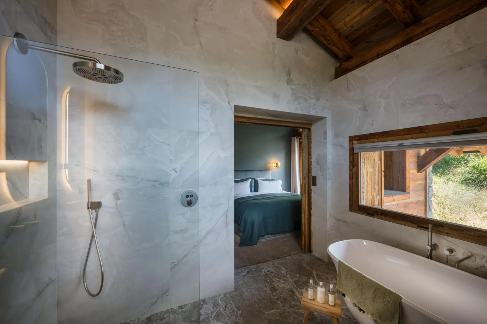 En-suite bathroom with a bath and glass shower enclosure