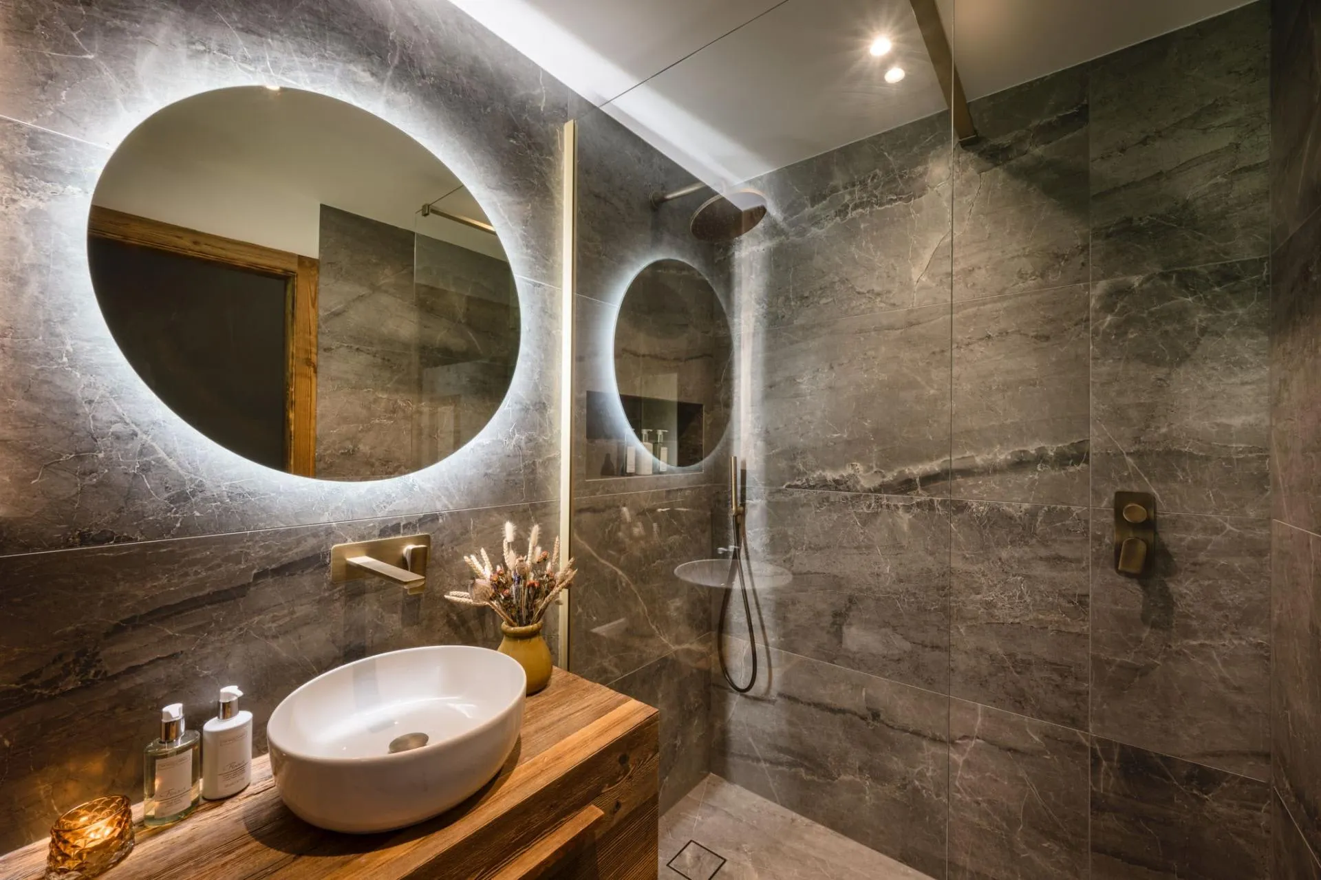 En-suite shower room with basin and heated towel rail