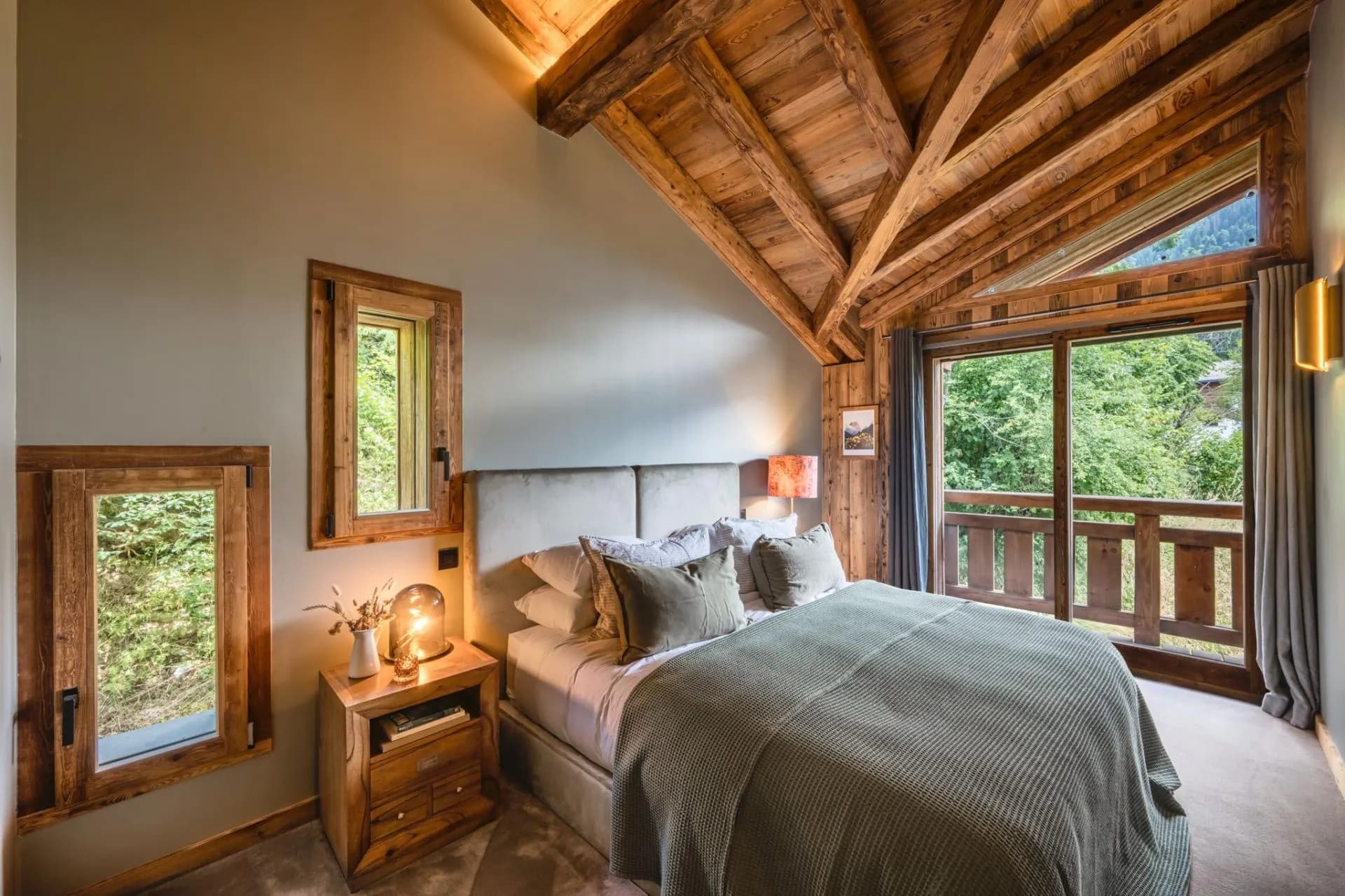 Double bedroom with balcony doors and mountain views