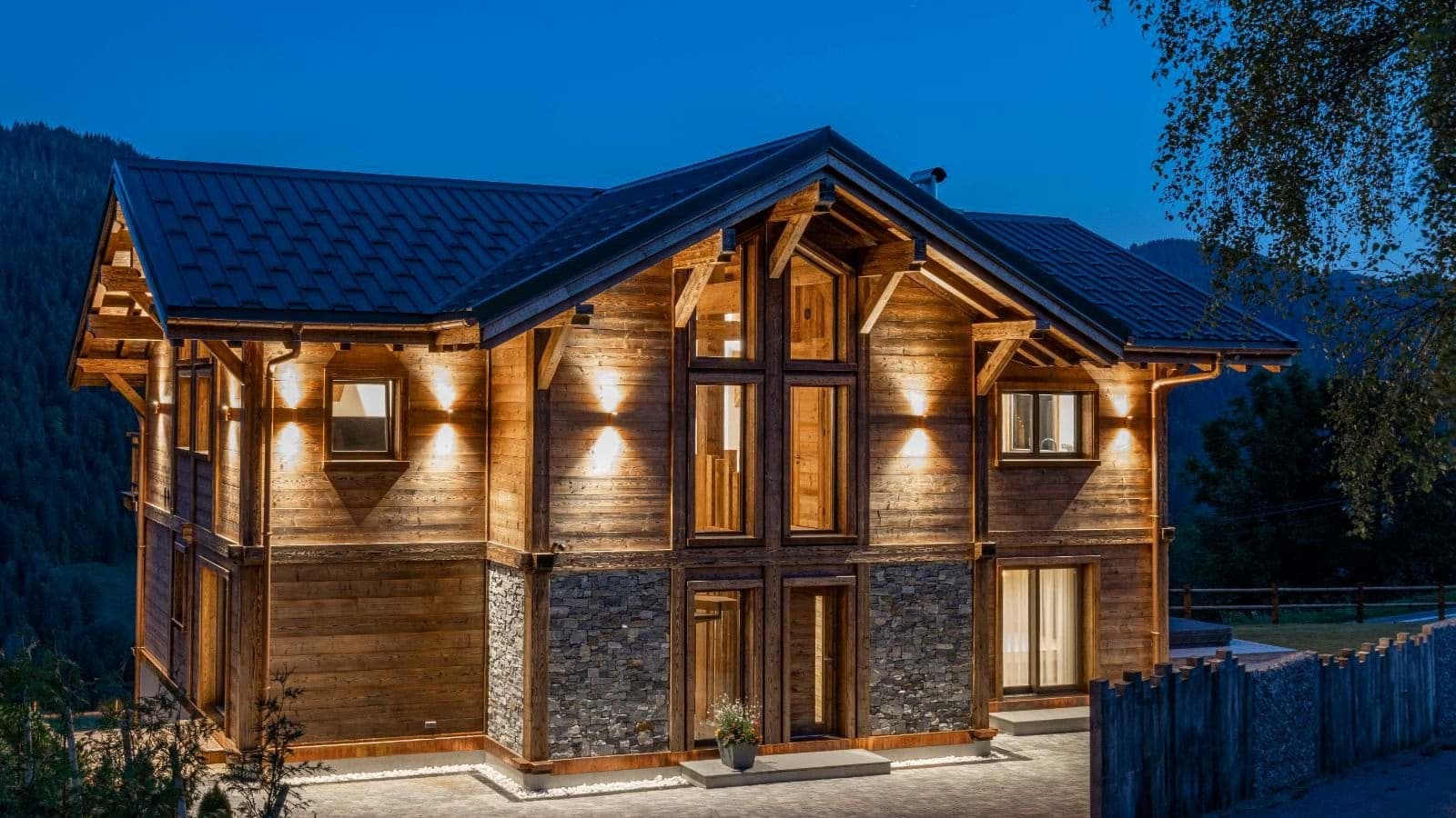 Chalet exterior with timber facade and floor-to-ceiling cathedral windows