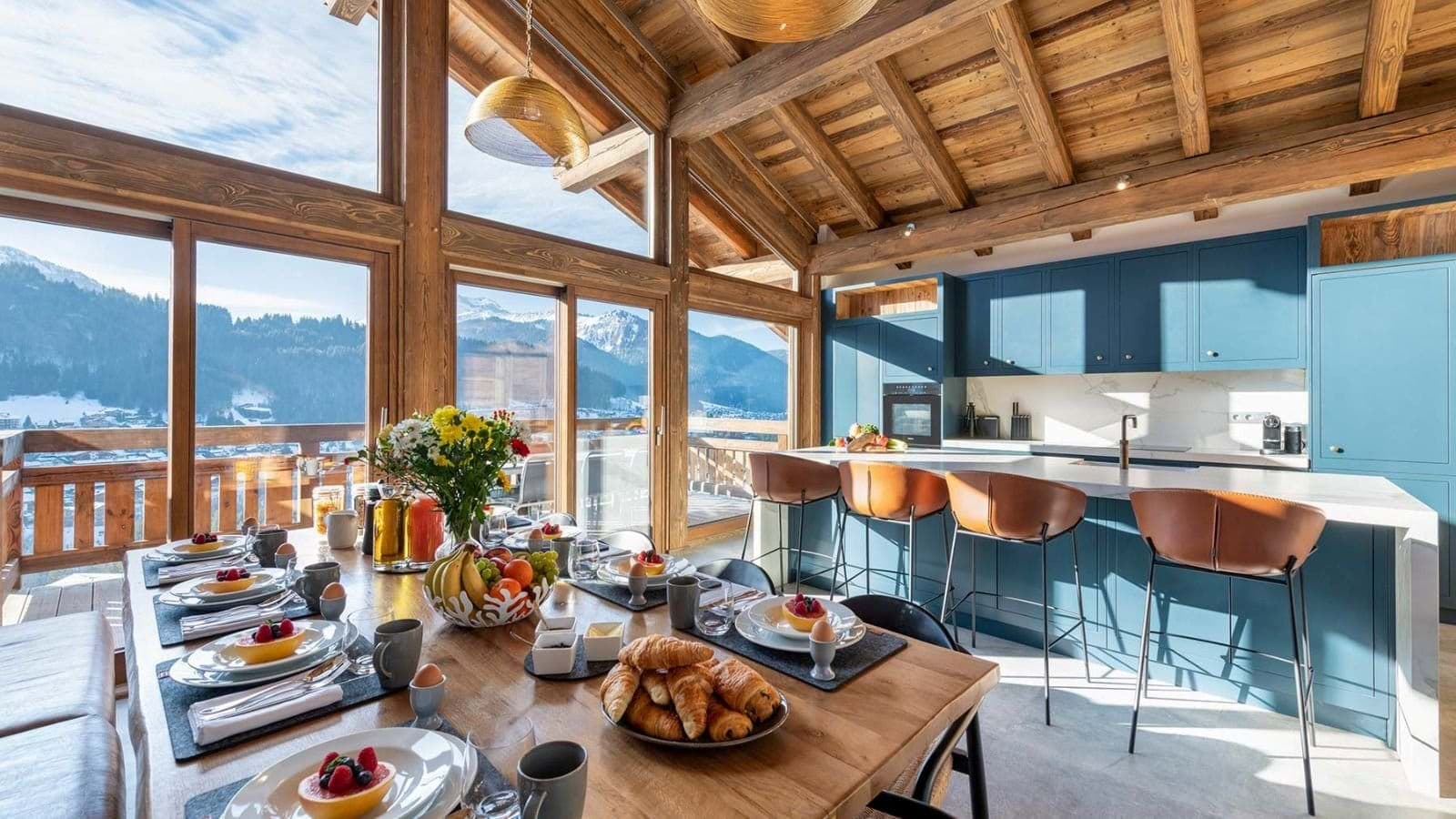 Open-plan kitchen and dining area with mountain views and island seating for 4