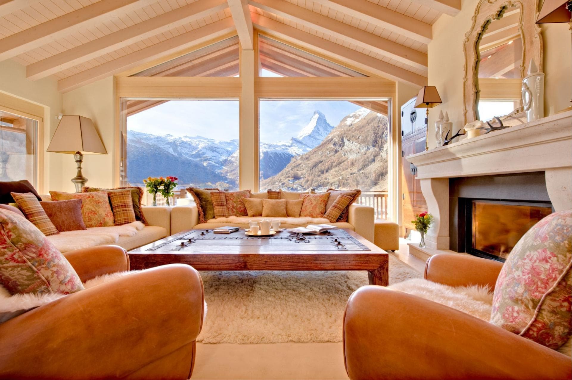 Living area with wood-burning fireplace and direct views of the Matterhorn