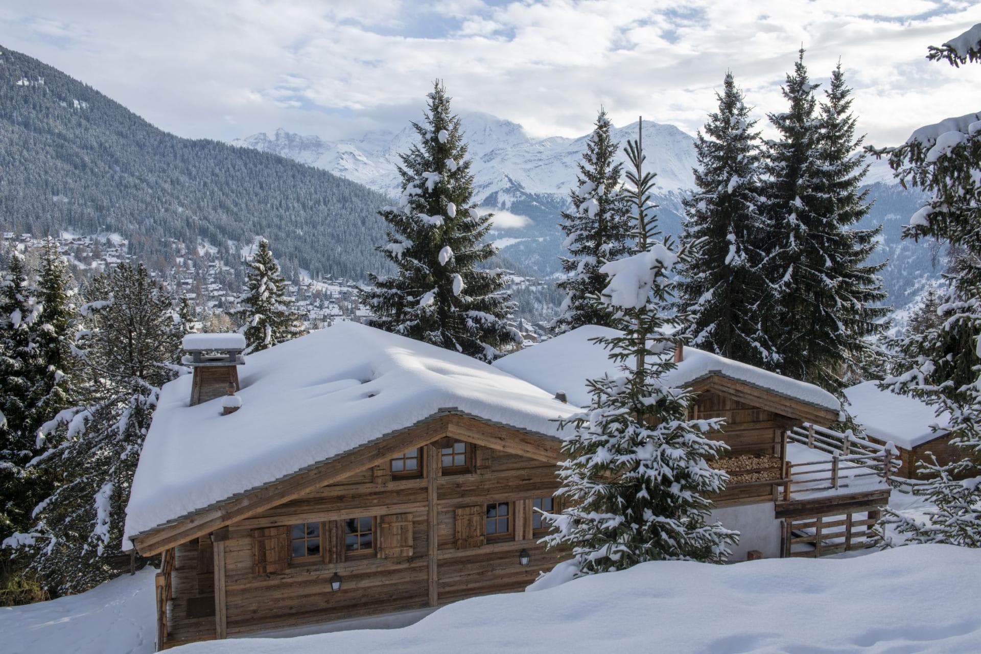 Chalet exterior with mountain views and firewood storage alcove