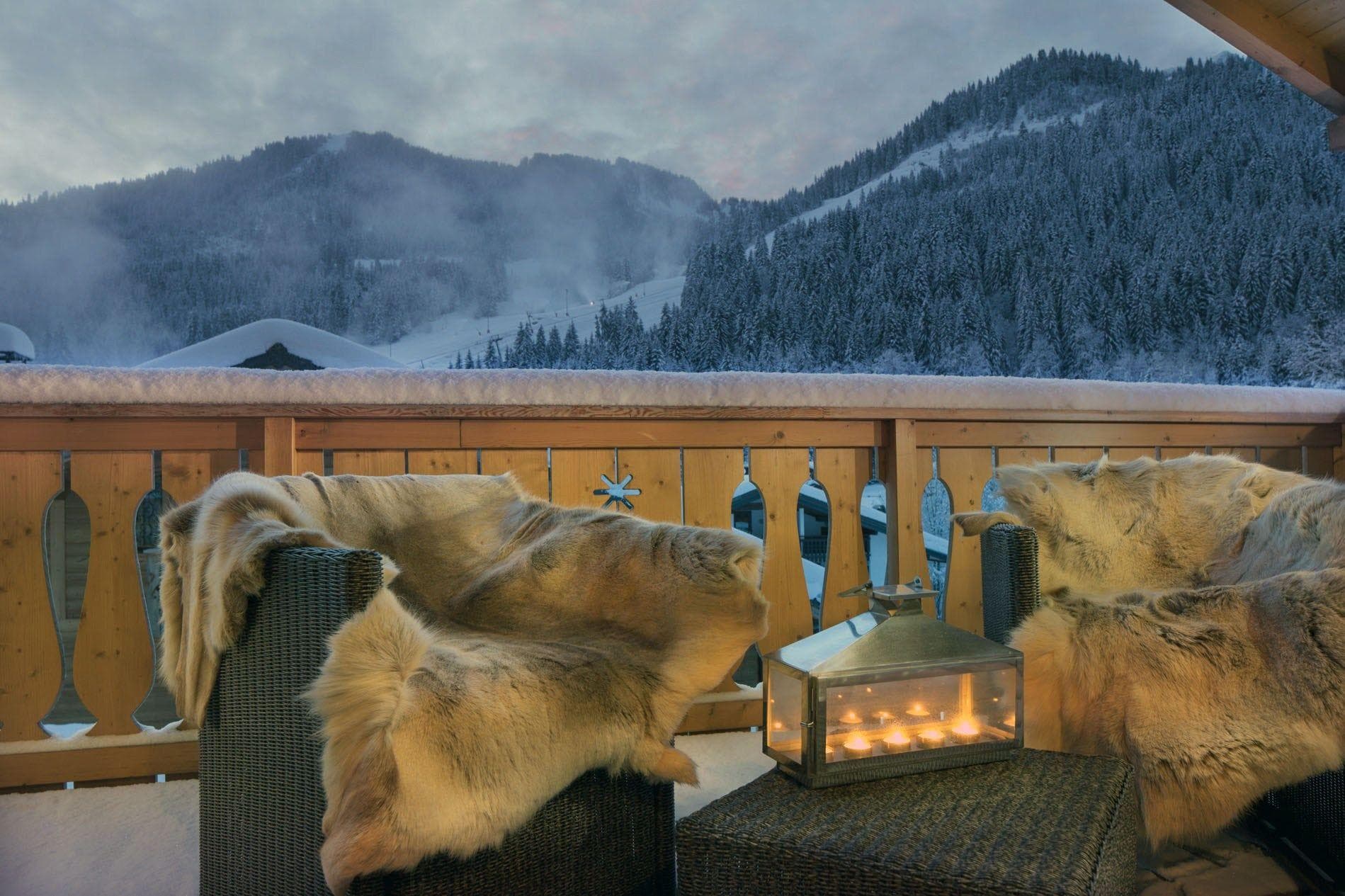 Private balcony with lounge seating and views of the ski slopes