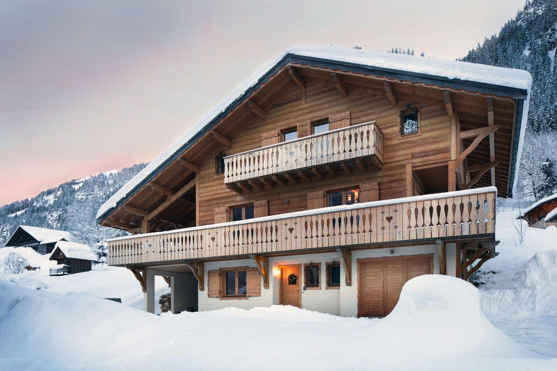 Ski-in chalet exterior with multi-level balconies and heated garage