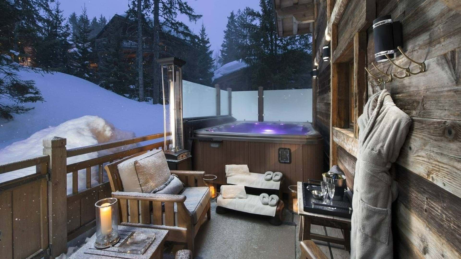 Private deck with hot tub, heat lamp, and privacy glass