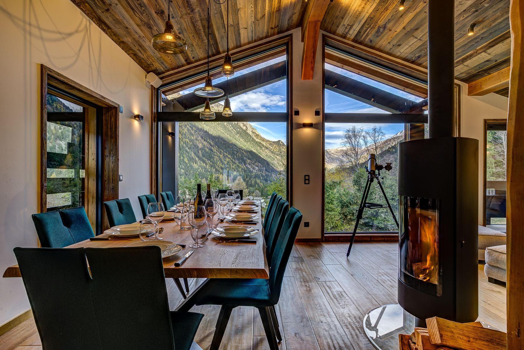 Dining area seats 10 with mountain views and wood-burning stove