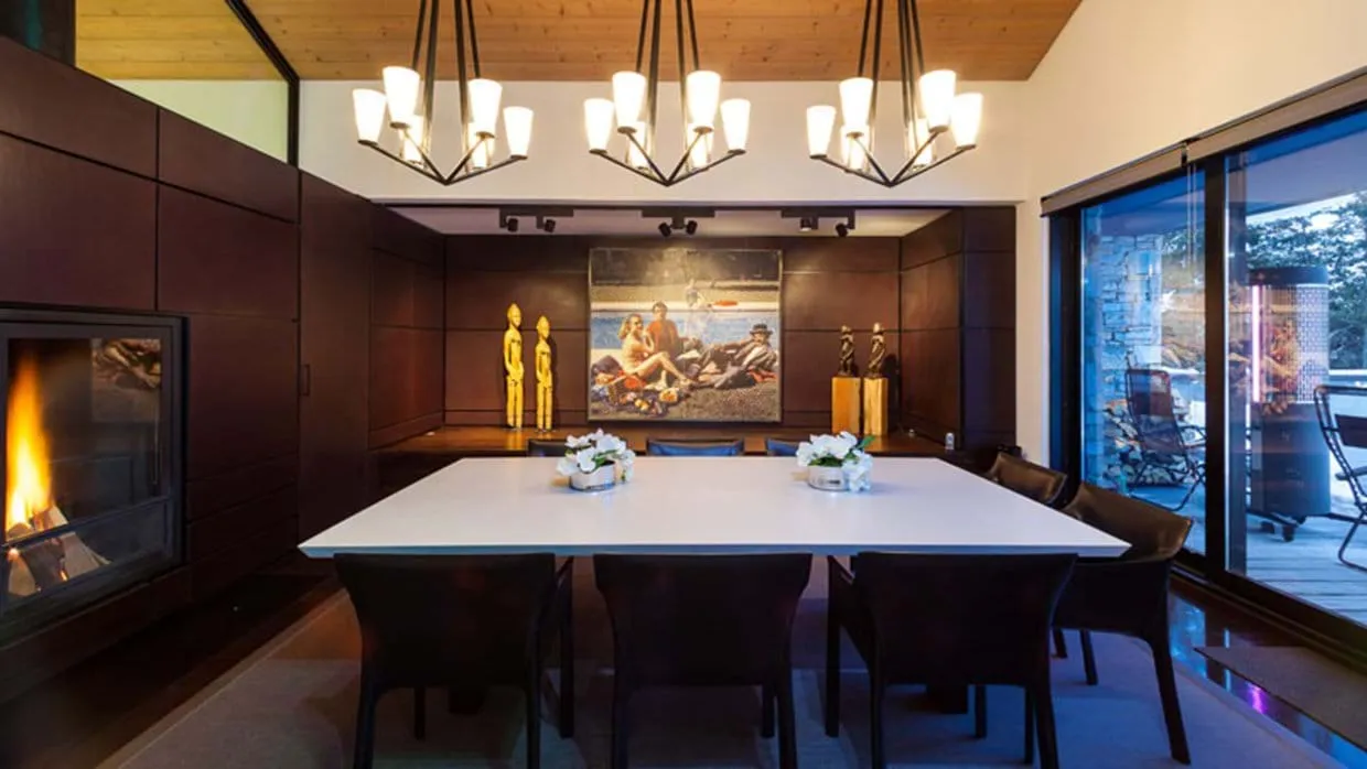 Dining area with seating for 8, gas fireplace, and deck access