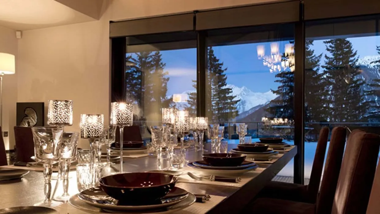 Dining area with seating for 10 and snowy mountain views