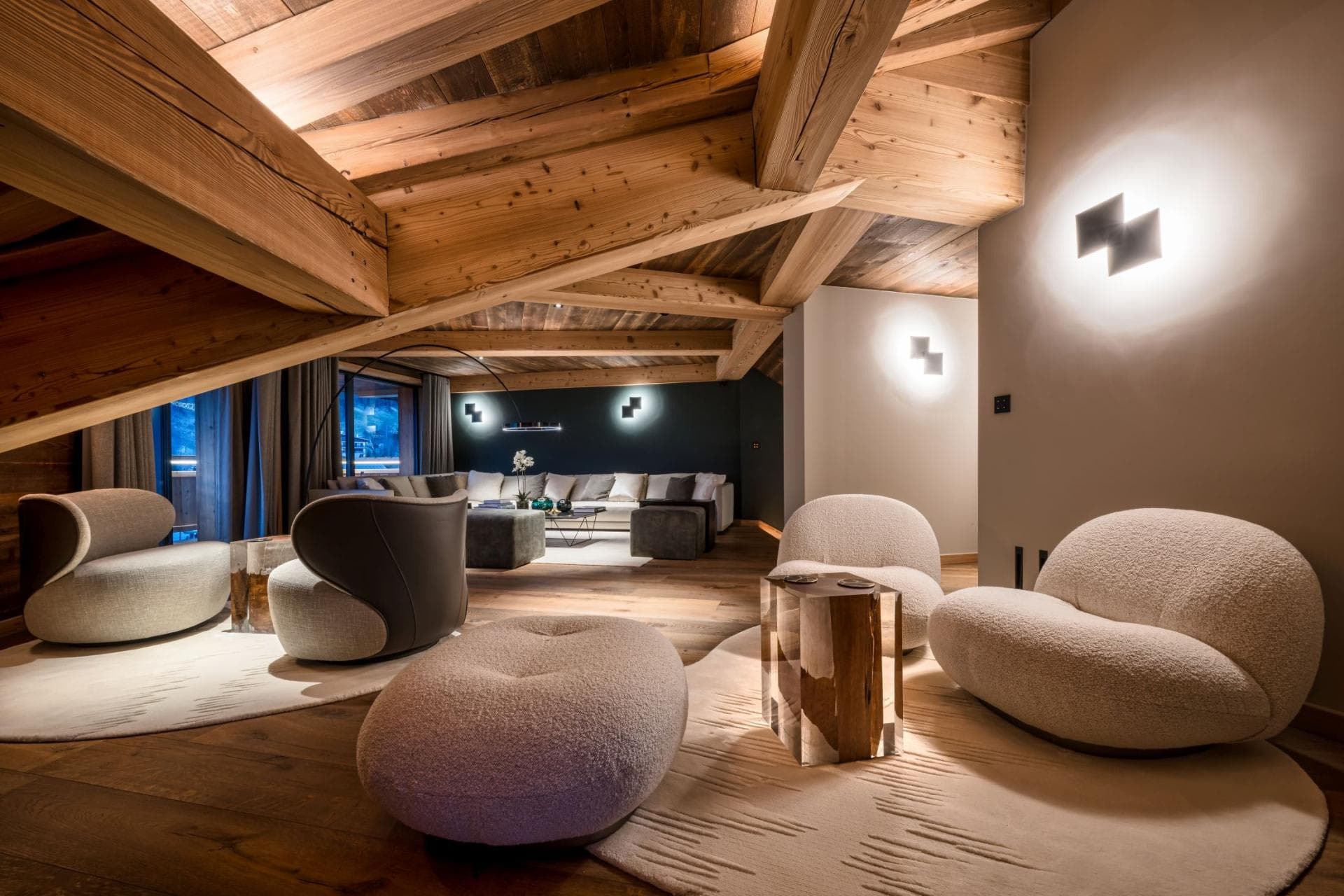 Lower-level lounge with vaulted timber ceilings and seating for 10