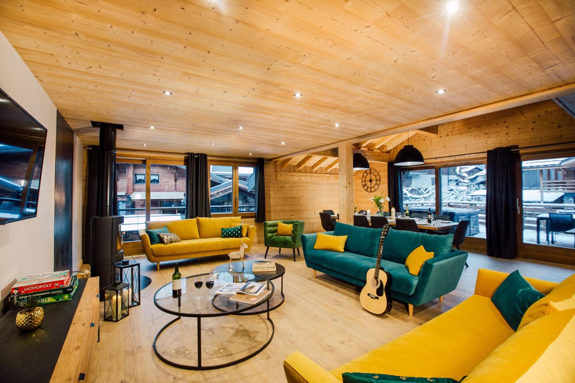 Open-plan living area with wood stove and seating for 10