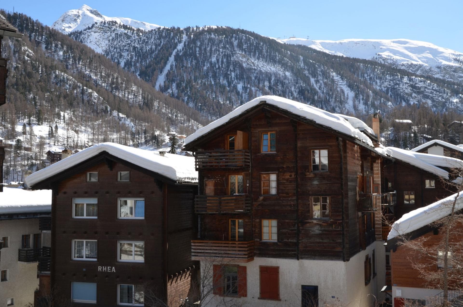 Timber chalet exterior with private balconies and direct Matterhorn valley views
