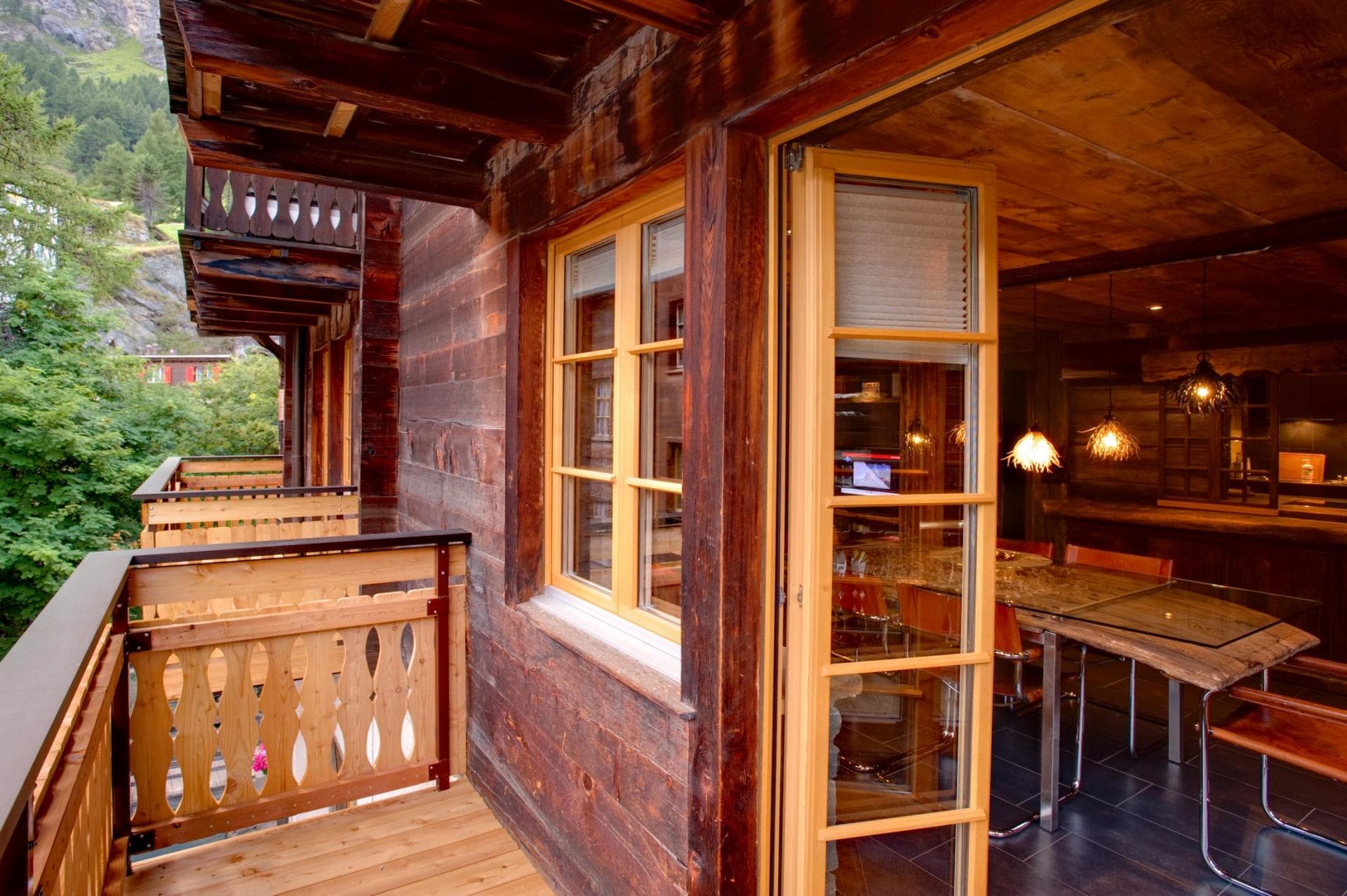 Private timber balcony overlooking forest with access to dining area