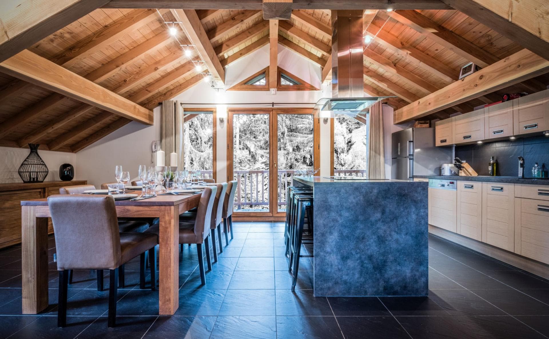 Kitchen and dining area seats 8; vaulted wood-beam ceilings