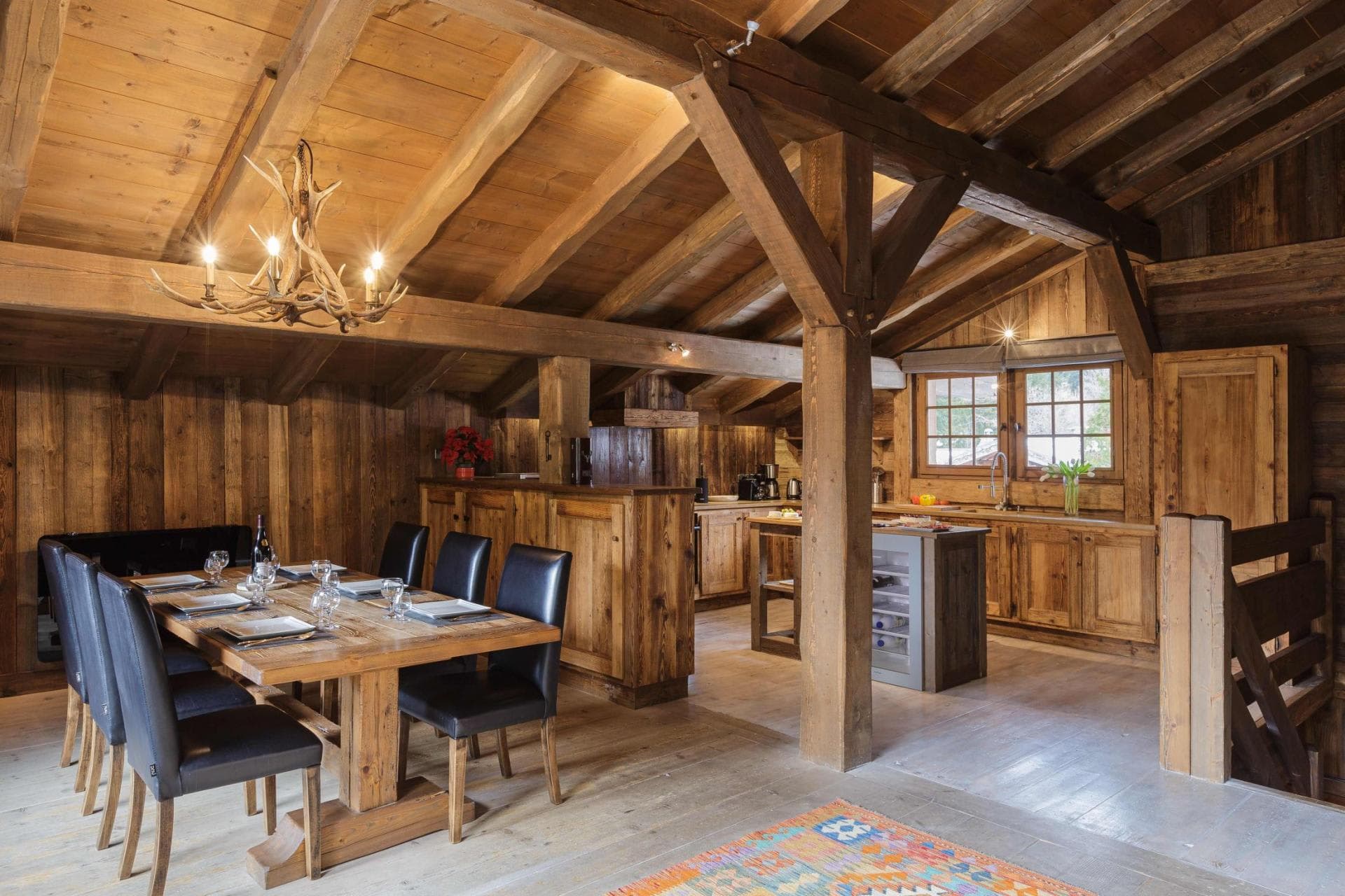 Open-plan dining area and kitchen with wine fridge and seating for 8