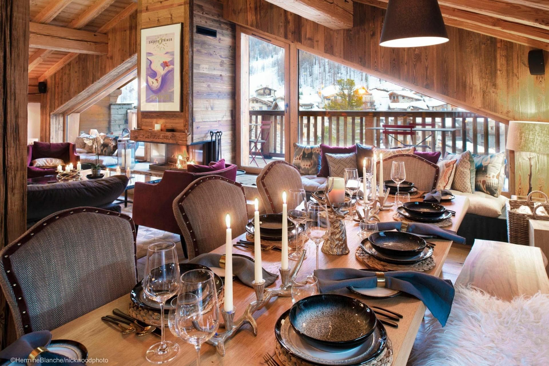 Dining area with seating for 8; adjacent to double-sided fireplace