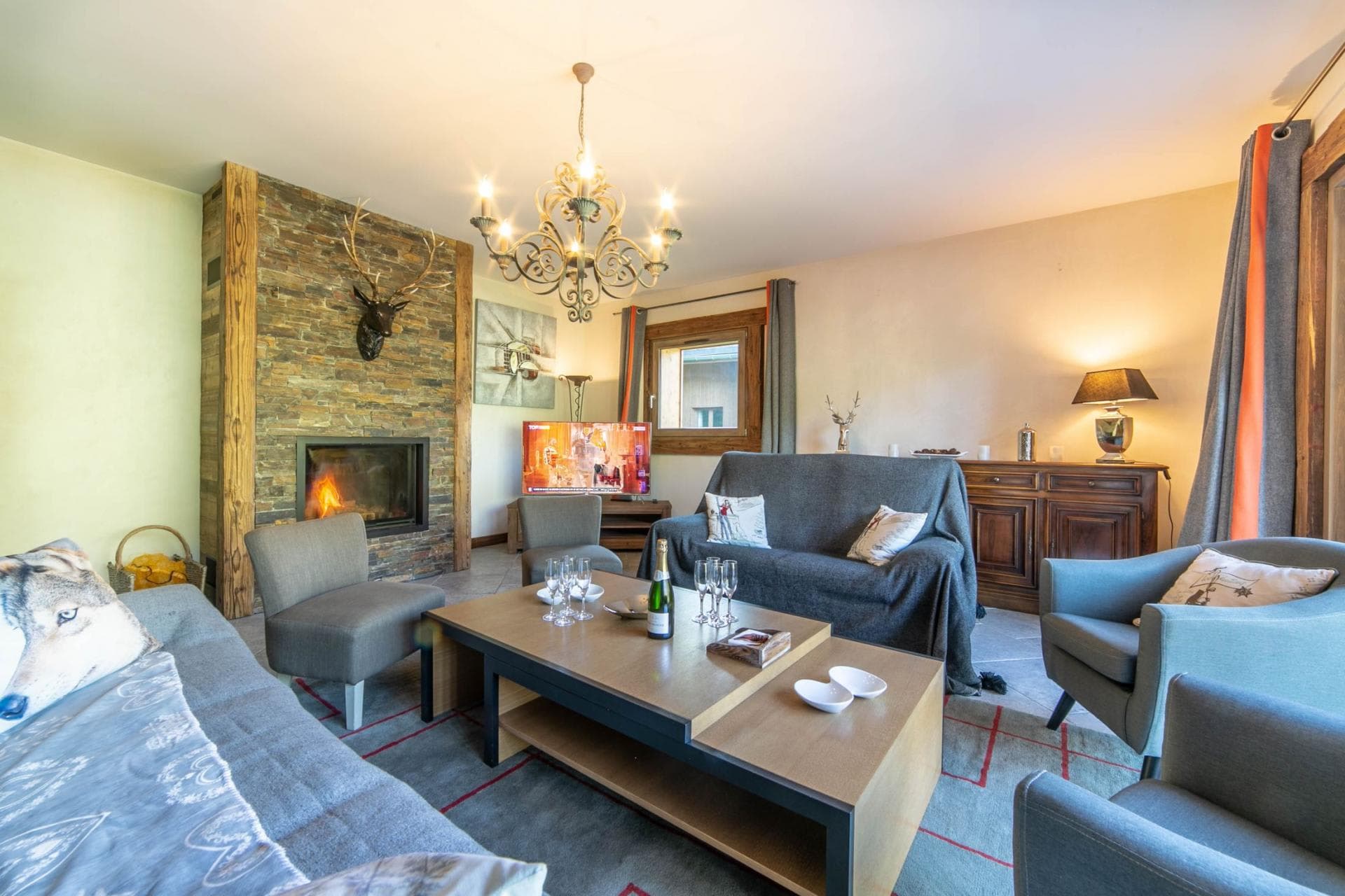 Living area with wood-burning fireplace and seating for 7