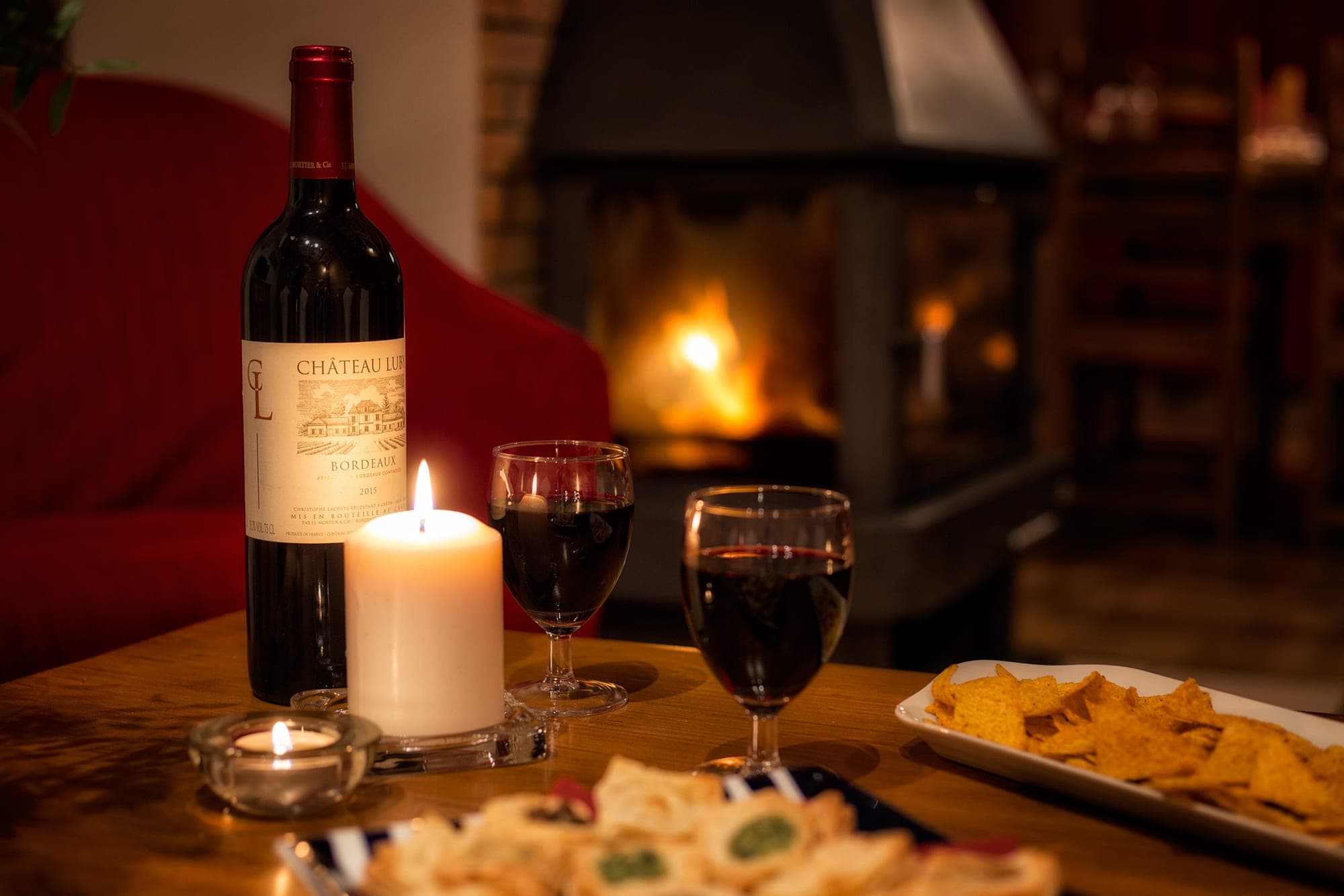 Living area featuring wood-burning fireplace and provided snacks and wine