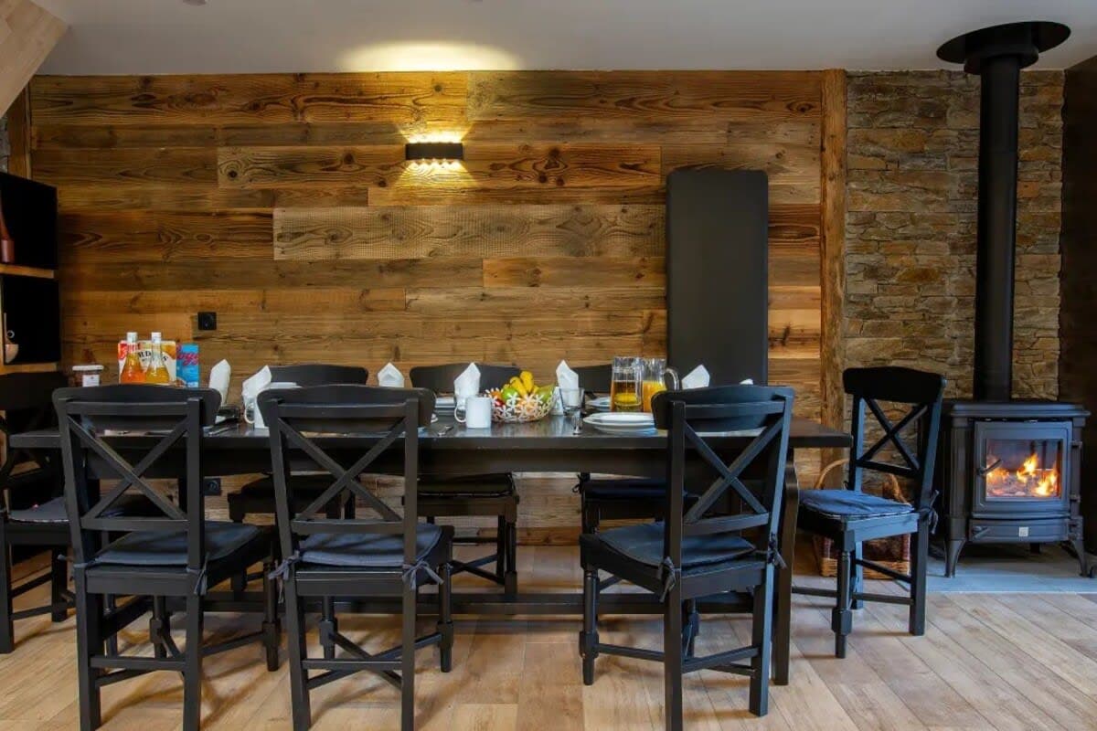 Dining table with seating for 8 and wood-burning stove