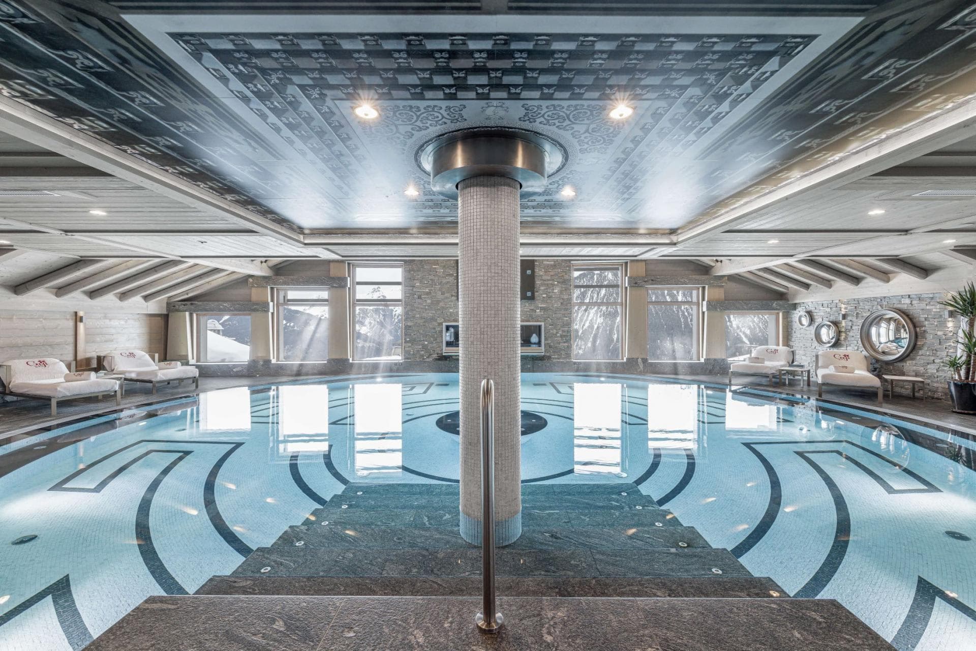 Indoor pool with lane markings; central support column, heated throughout