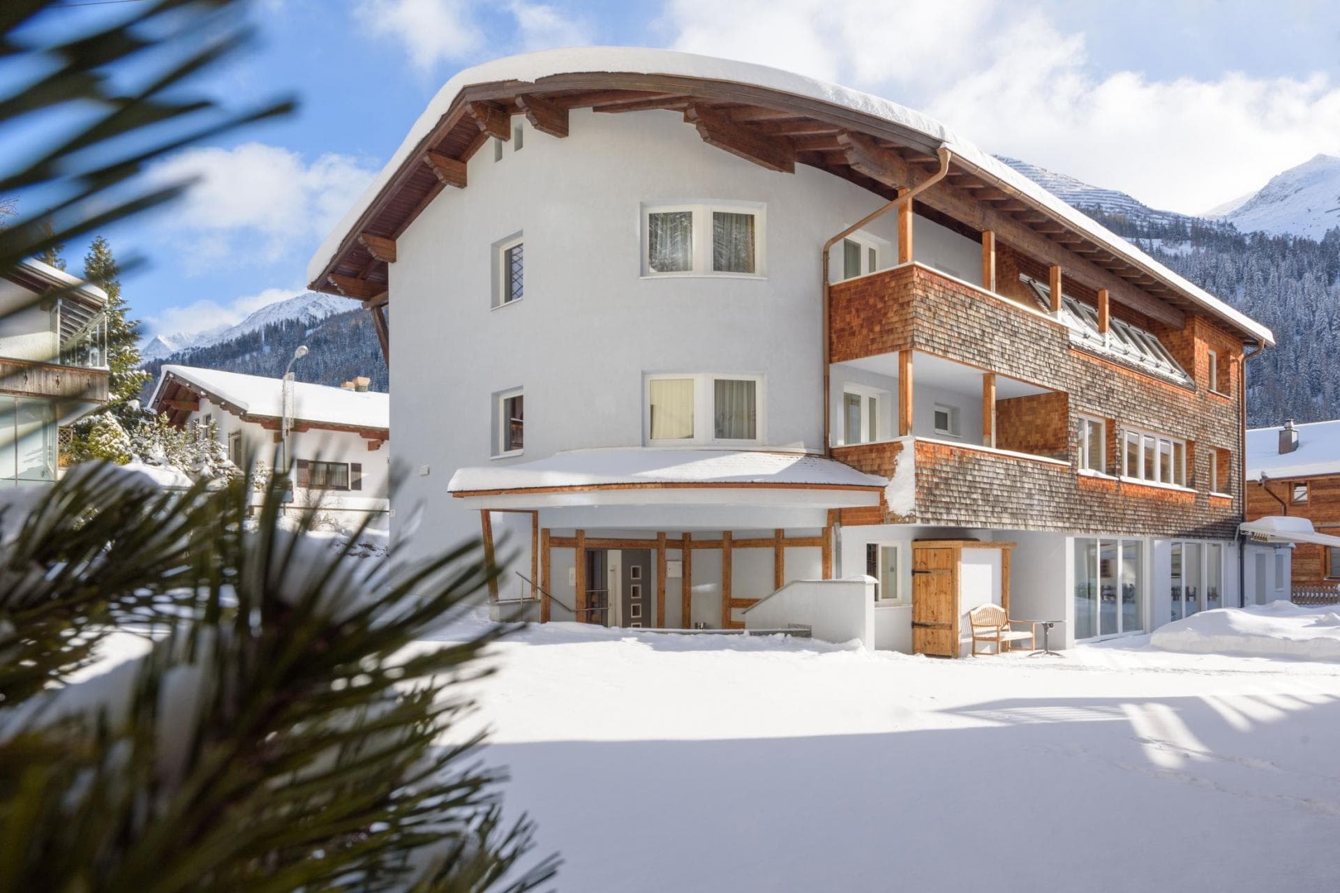 Chalet exterior with private balconies and mountain views