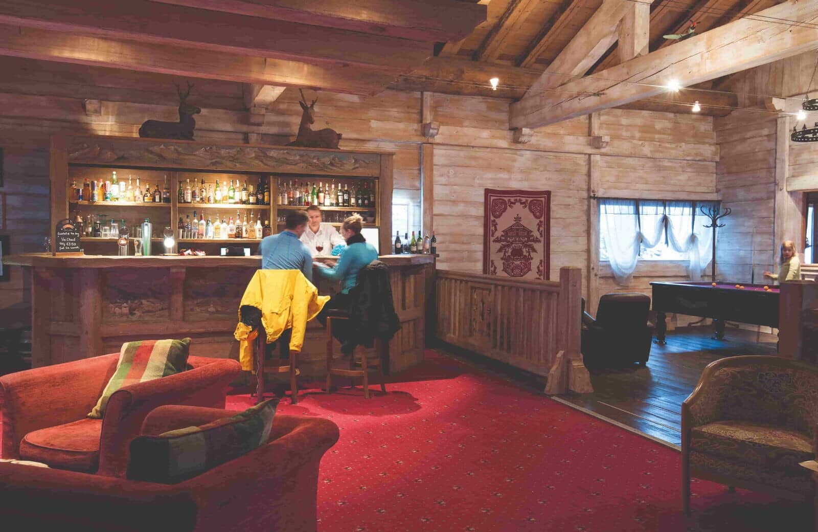 Lodge lounge with full-service bar and pool table