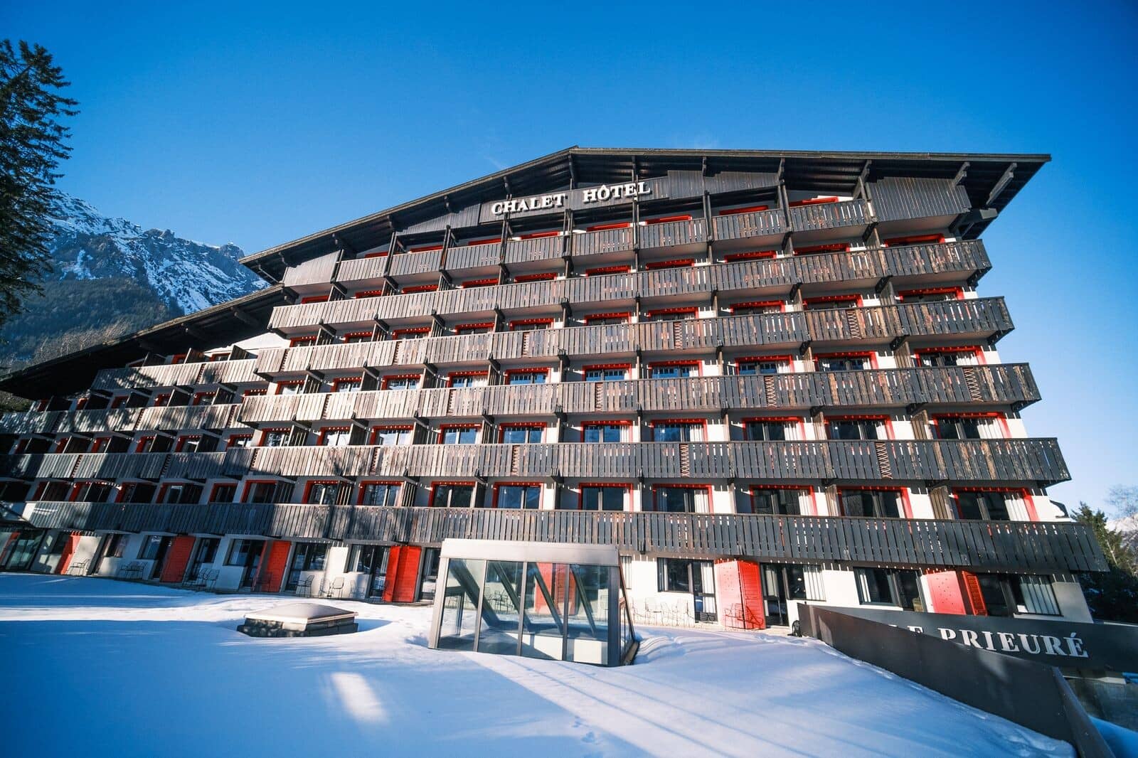 Chalet Hotel exterior with private balconies and mountain views