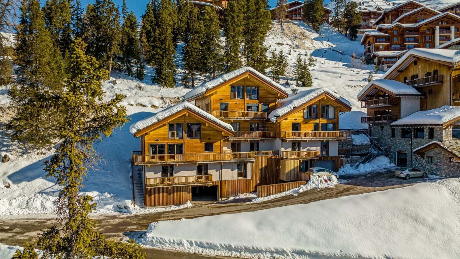 Ski-in/ski-out chalet exterior with private balconies and garage parking