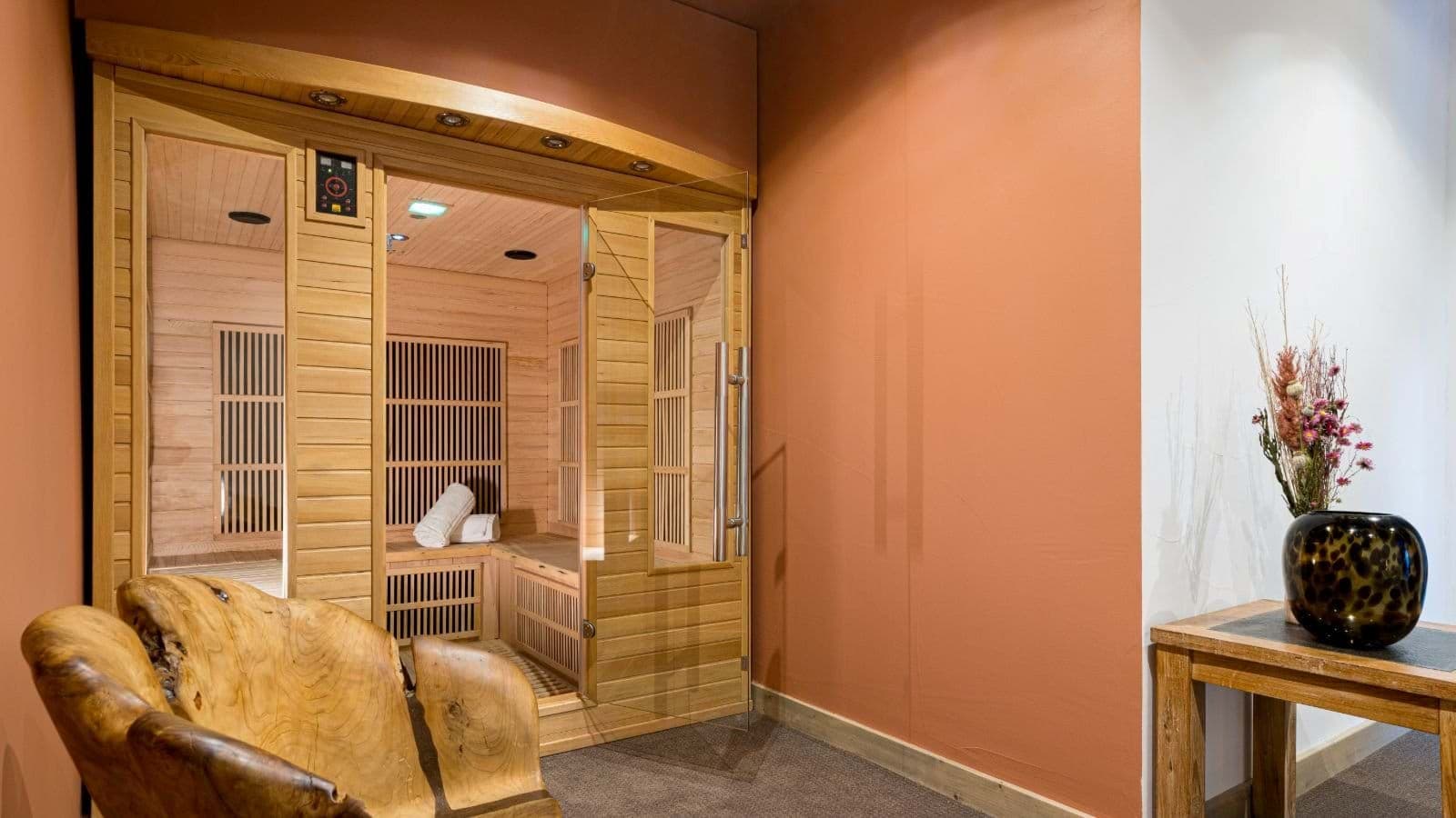 Private infrared sauna with digital controls and glass door entry