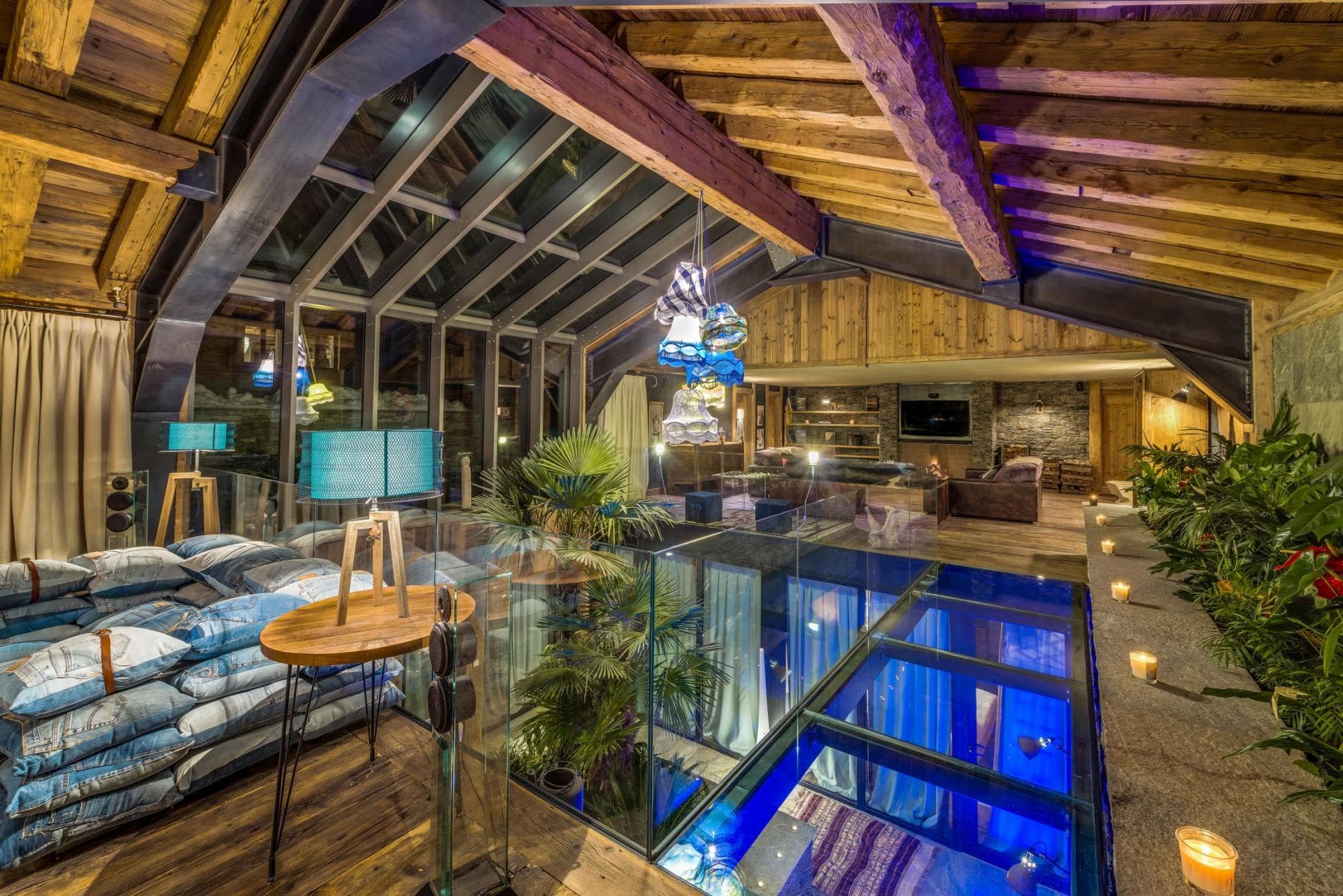 Loft lounge with glass floor and vaulted timber ceiling