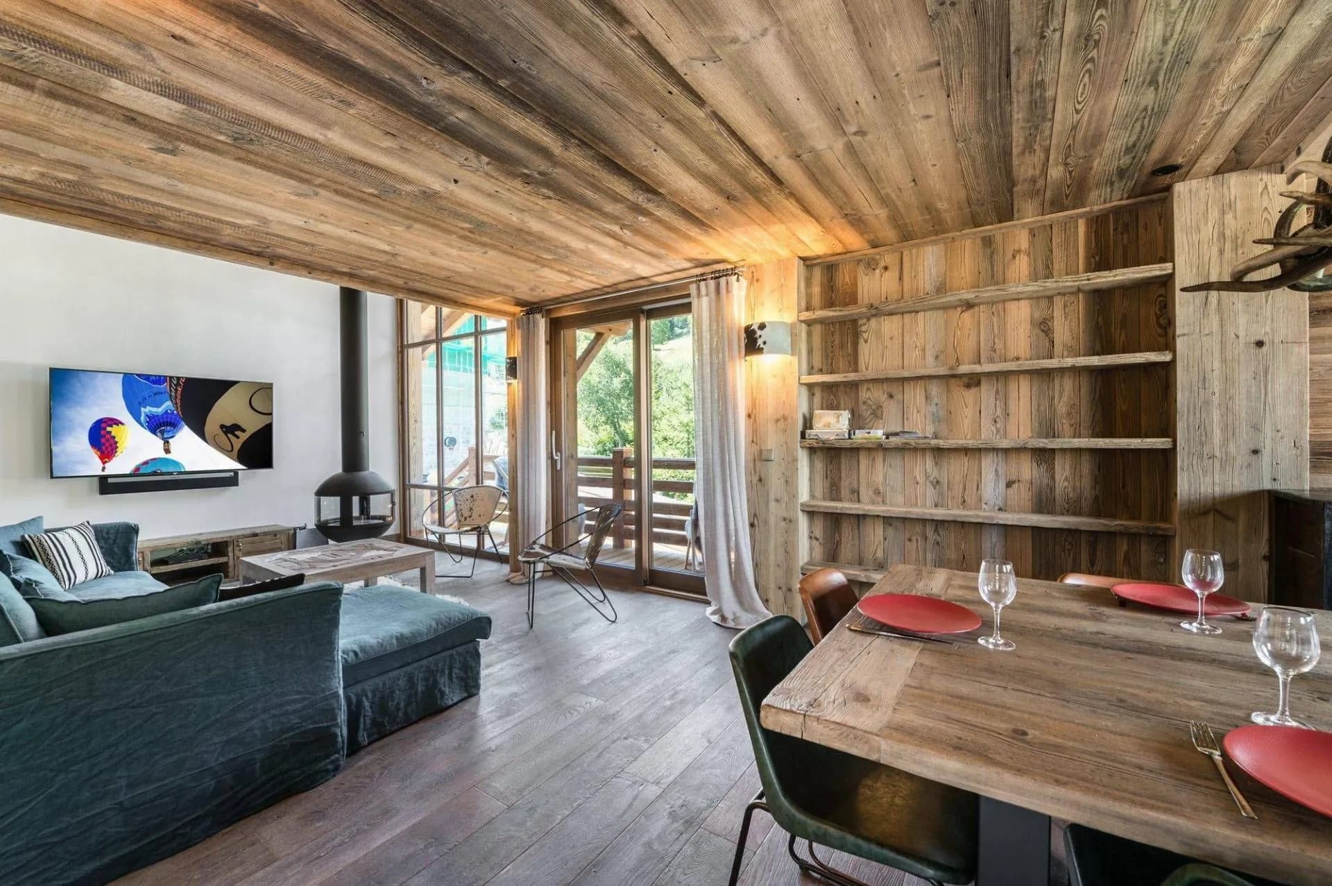 Open-plan living and dining area with balcony doors