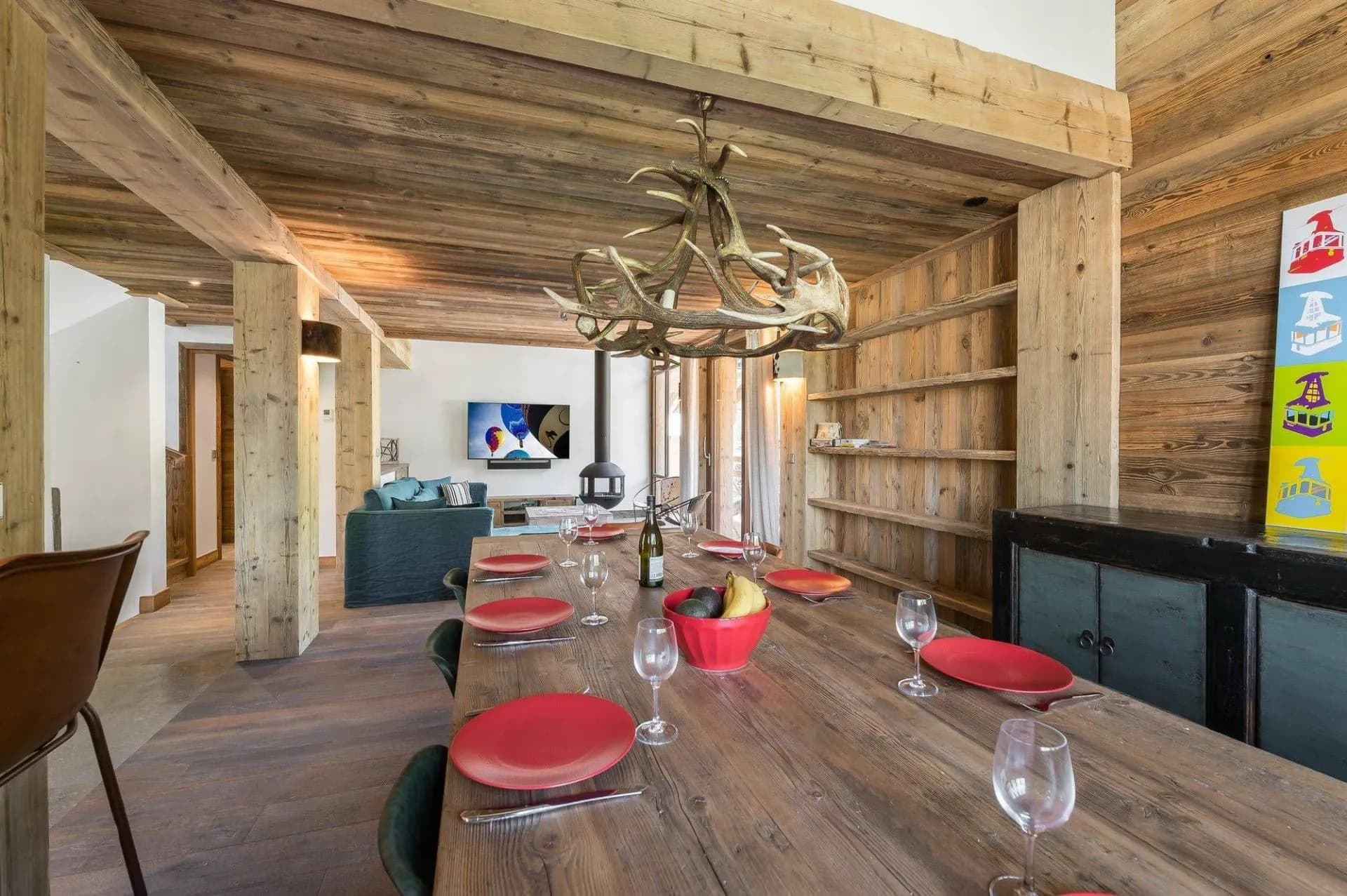 Dining area beside the lounge and wood fireplace