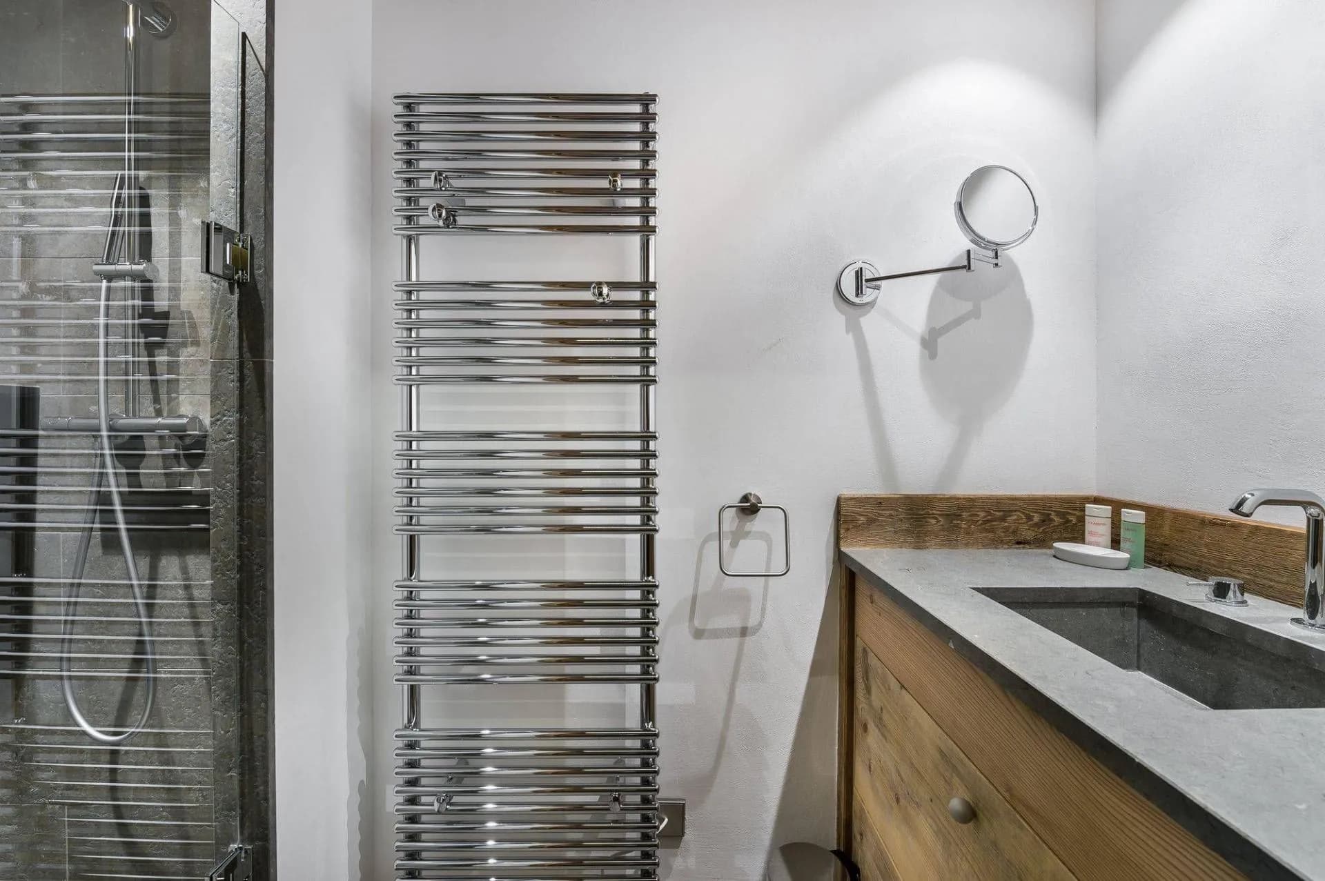 En-suite shower room with a single basin and heated towel rail